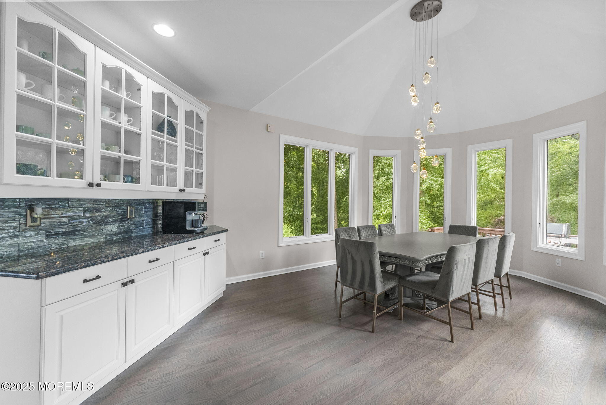 16 Shallow Brook Road Morganville, NJ 07751 - Photo 29 of 37 a large white kitchen with granite countertop a sink table and chairs