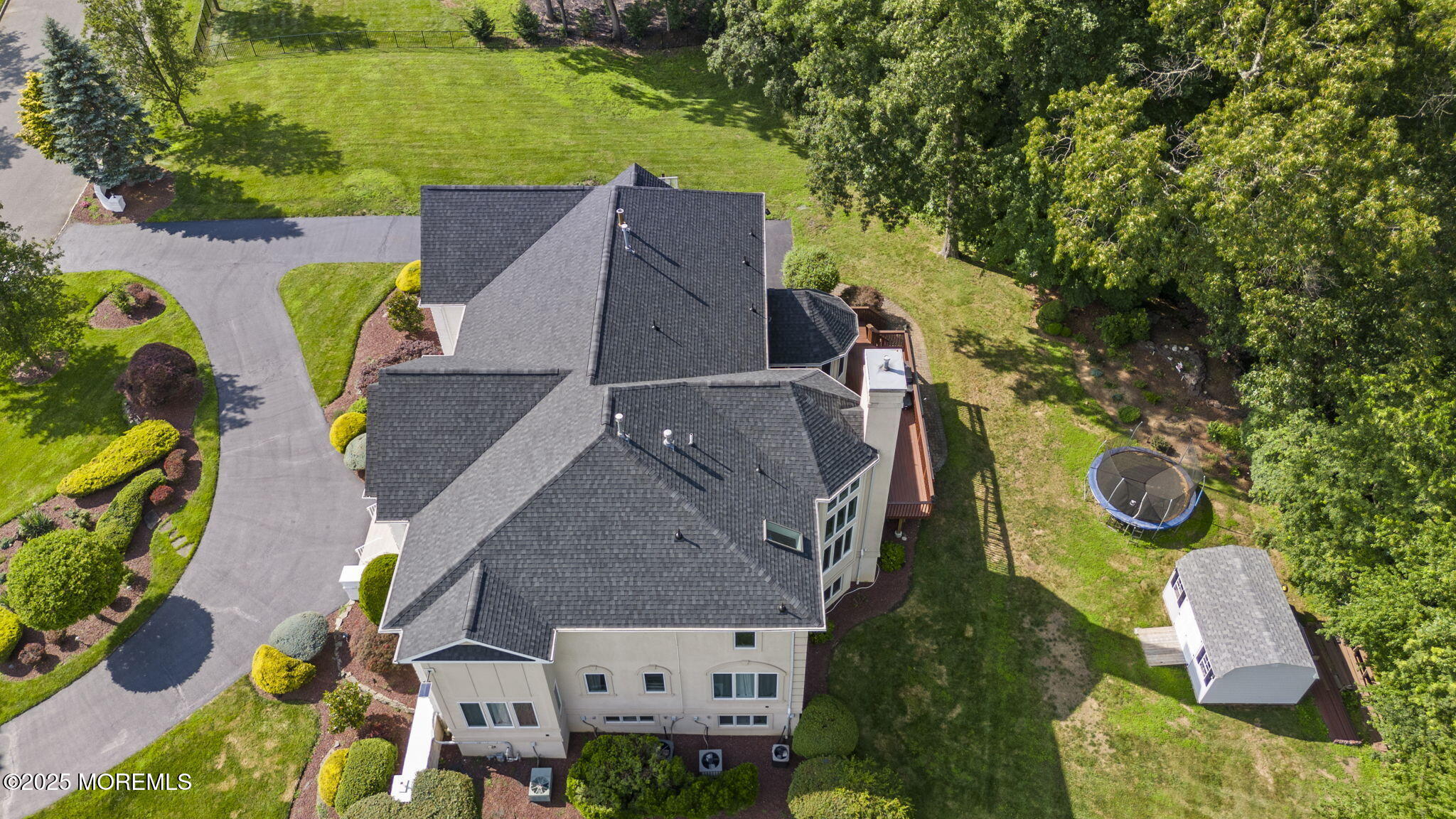 16 Shallow Brook Road Morganville, NJ 07751 - Photo 3 of 37 an aerial view of residential houses with outdoor space and parking