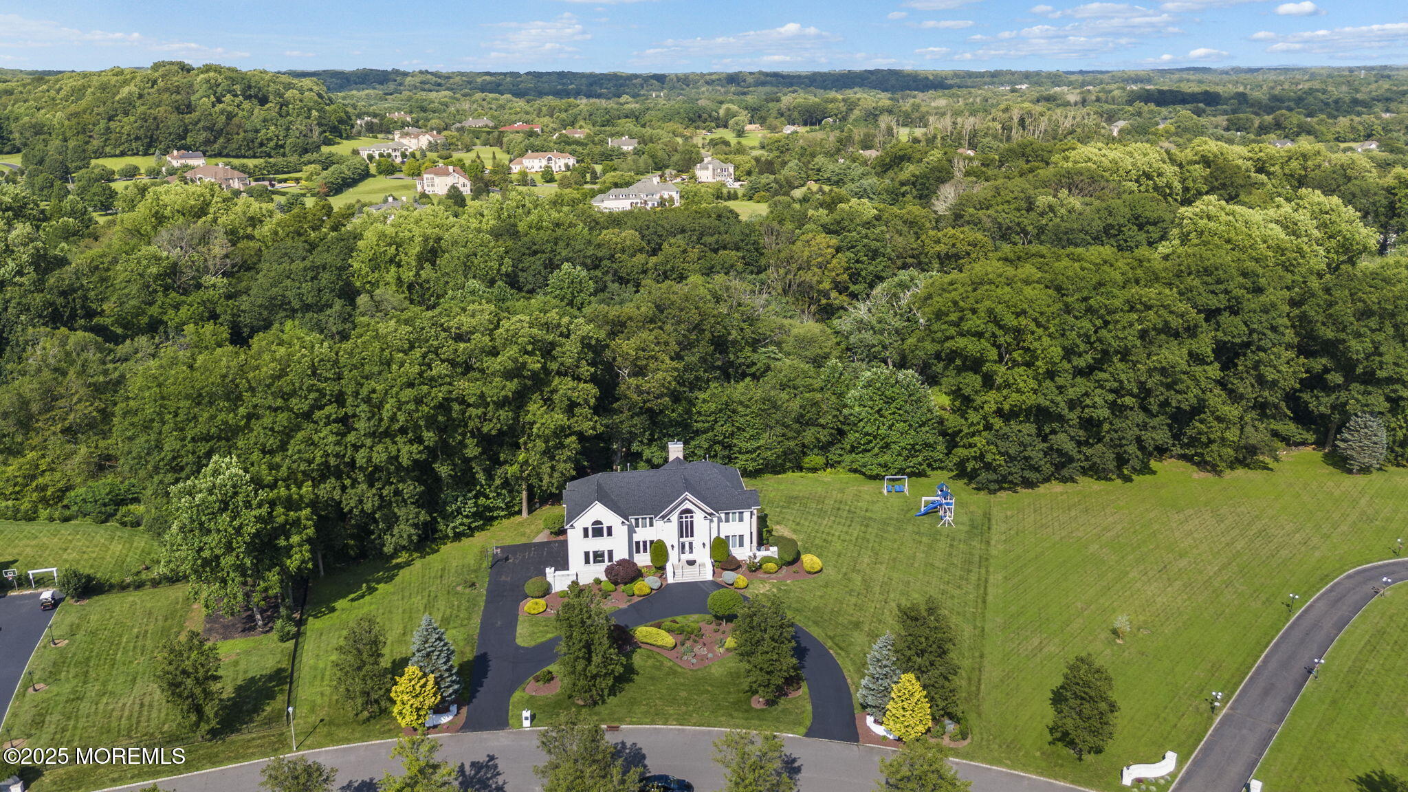 16 Shallow Brook Road Morganville, NJ 07751 - Photo 6 of 37 an aerial view of a house with a yard