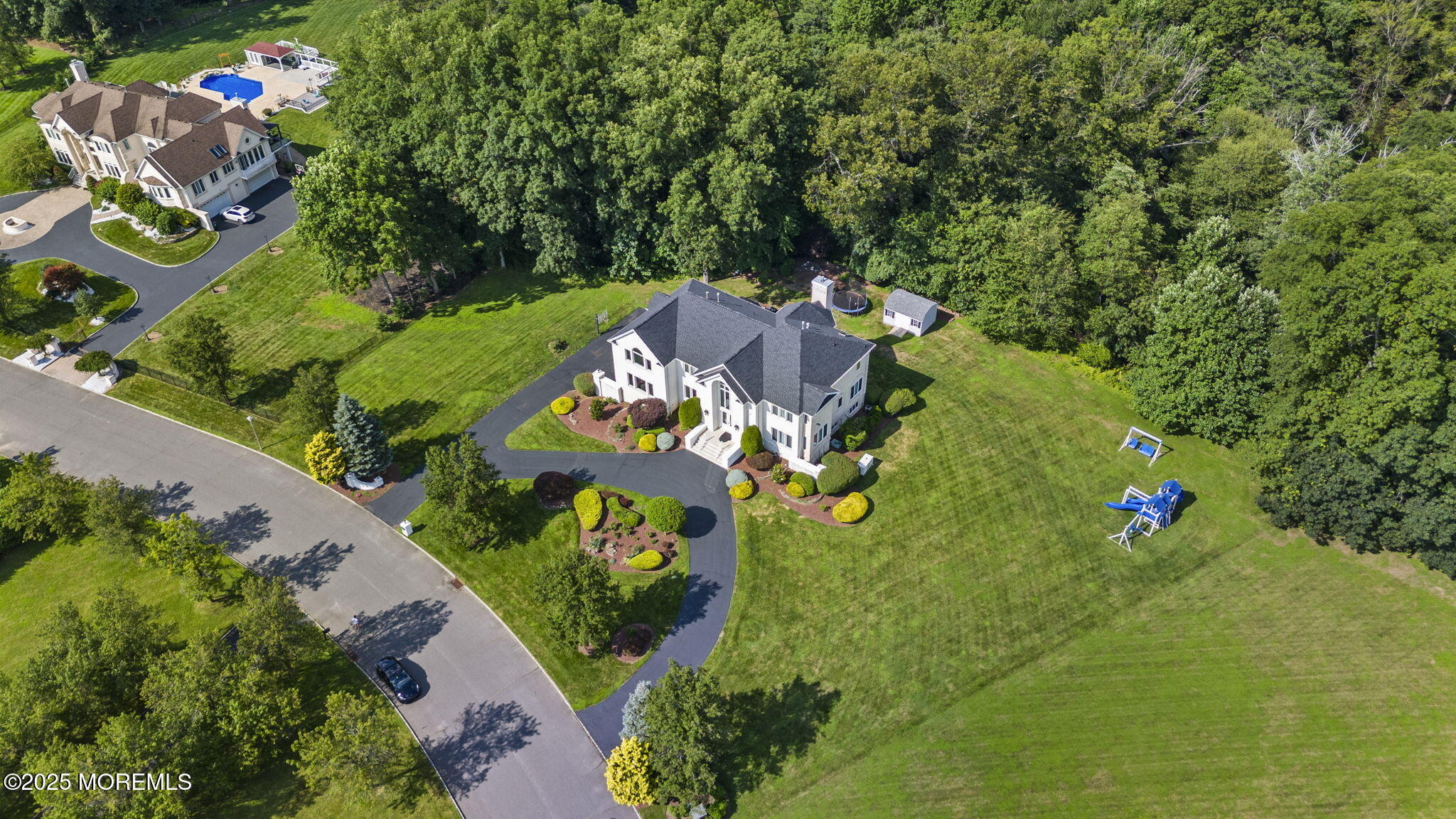 16 Shallow Brook Road Morganville, NJ 07751 - Photo 7 of 37 an aerial view of a house with yard