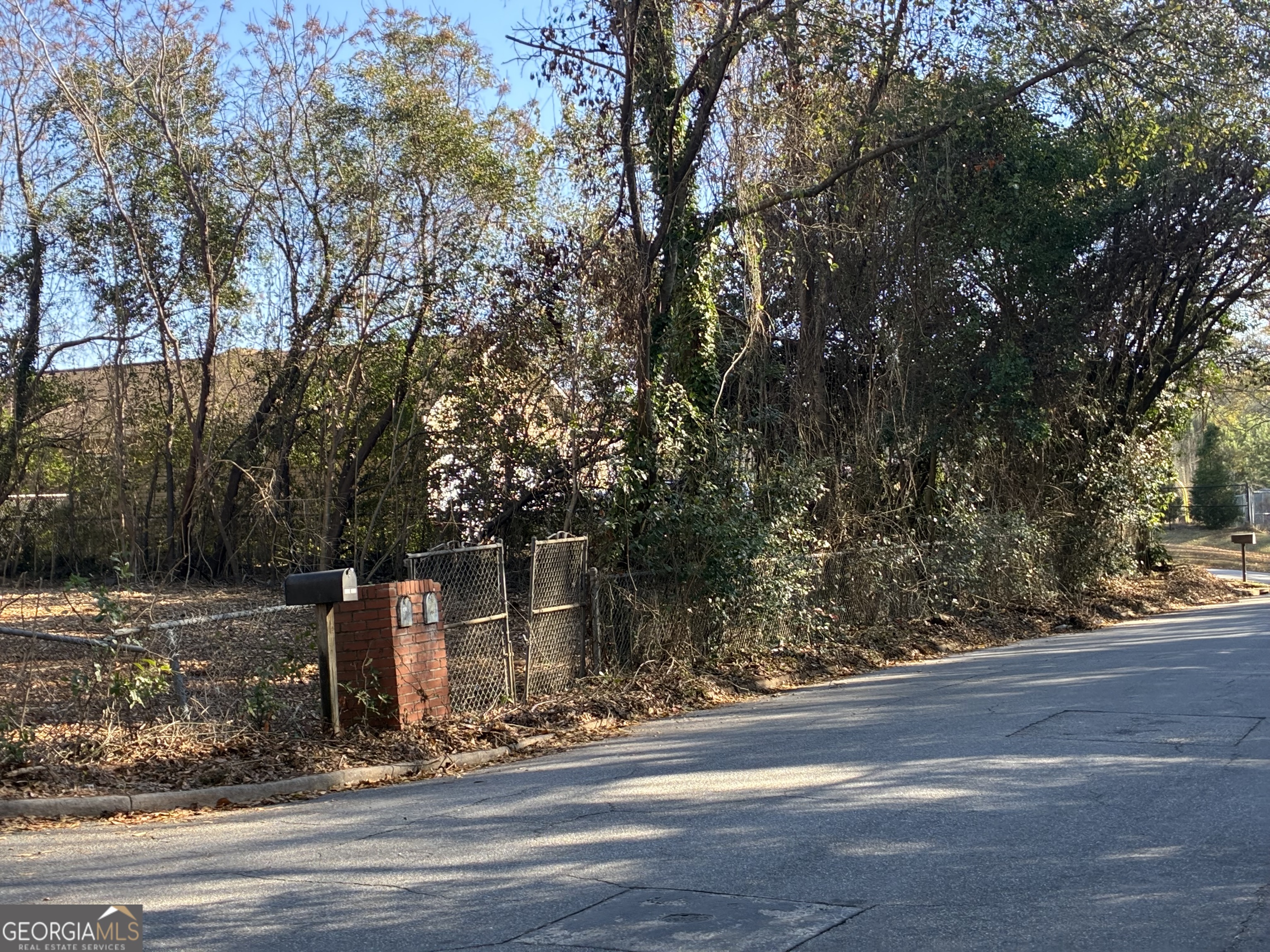 1316 Walls Road Macon, GA 31211 - Photo 5 of 9 a front view of a house with trees