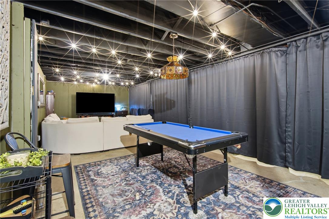 890 Lahr Road Nazareth, PA 18064 - Photo 33 of 71 An inviting entertainment space features concrete flooring and a pool table, perfect for gatherings.