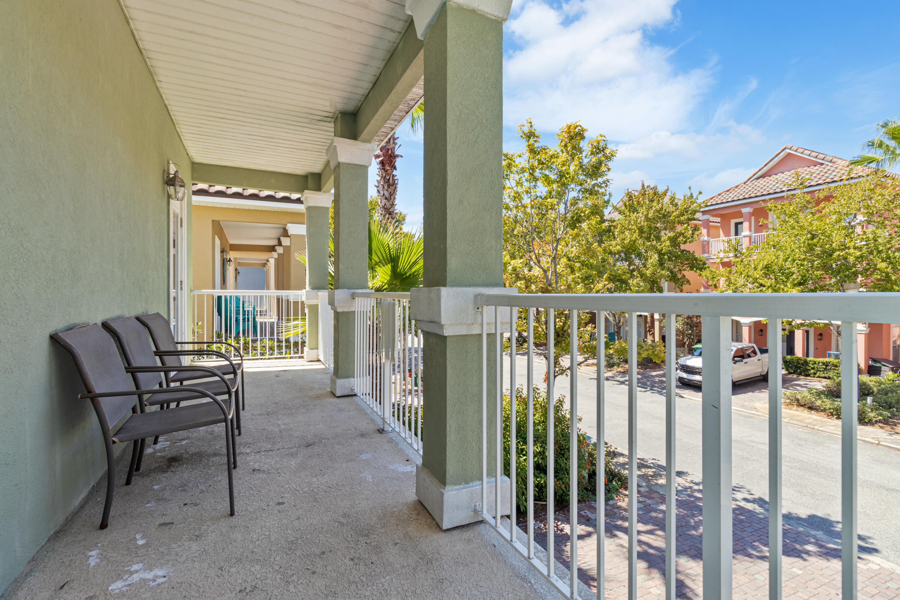 235 Kono Way Destin, FL 32541 - Photo 12 of 42 a view of a chair and tables in the balcony