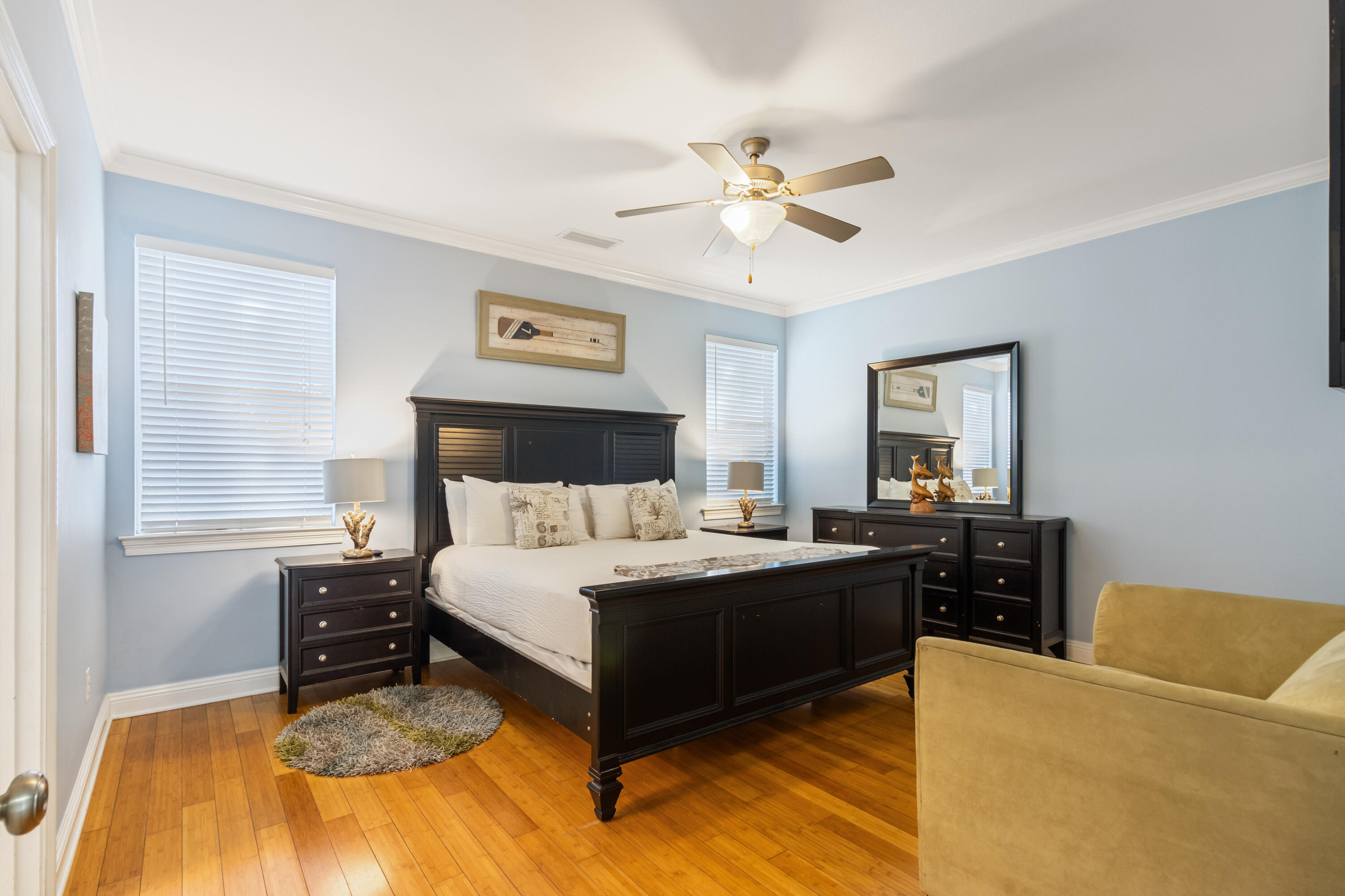 235 Kono Way Destin, FL 32541 - Photo 13 of 42 a bedroom with a bed and a chandelier