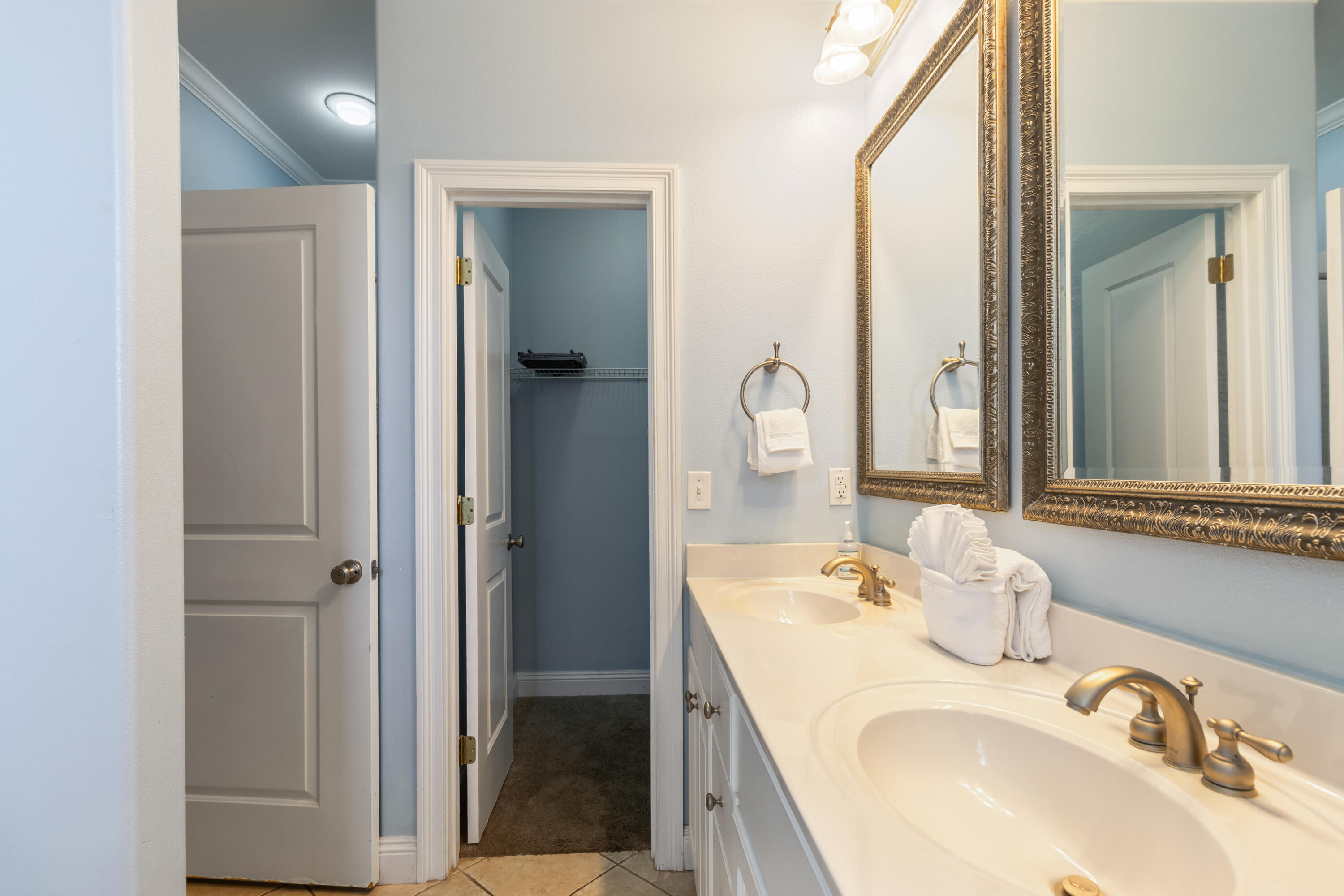 235 Kono Way Destin, FL 32541 - Photo 17 of 42 a bathroom with a sink and a mirror