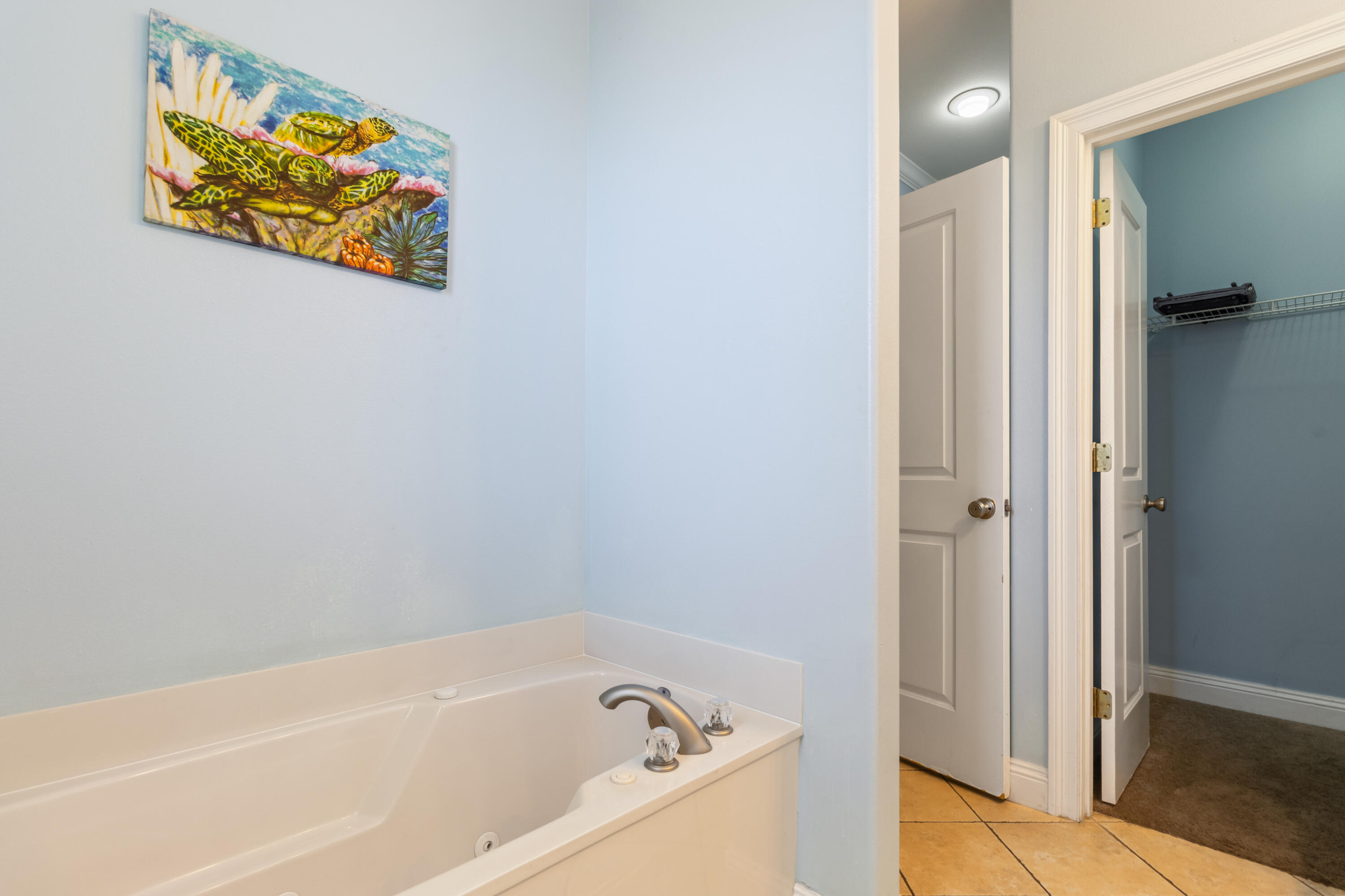 235 Kono Way Destin, FL 32541 - Photo 18 of 42 a bathroom with a bathtub and a shower