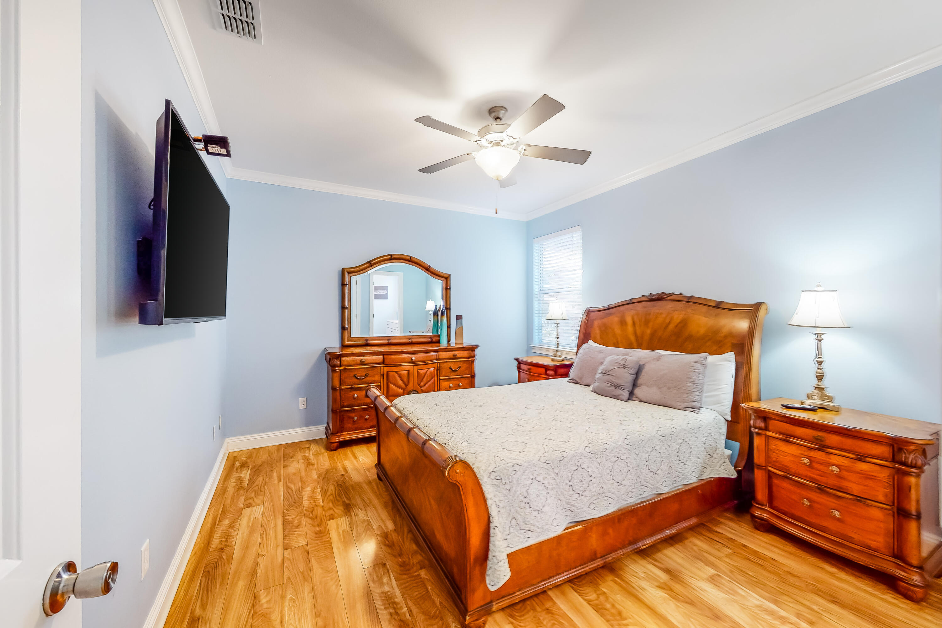 235 Kono Way Destin, FL 32541 - Photo 26 of 42 a bedroom with a bed and a flat tv screen on dresser