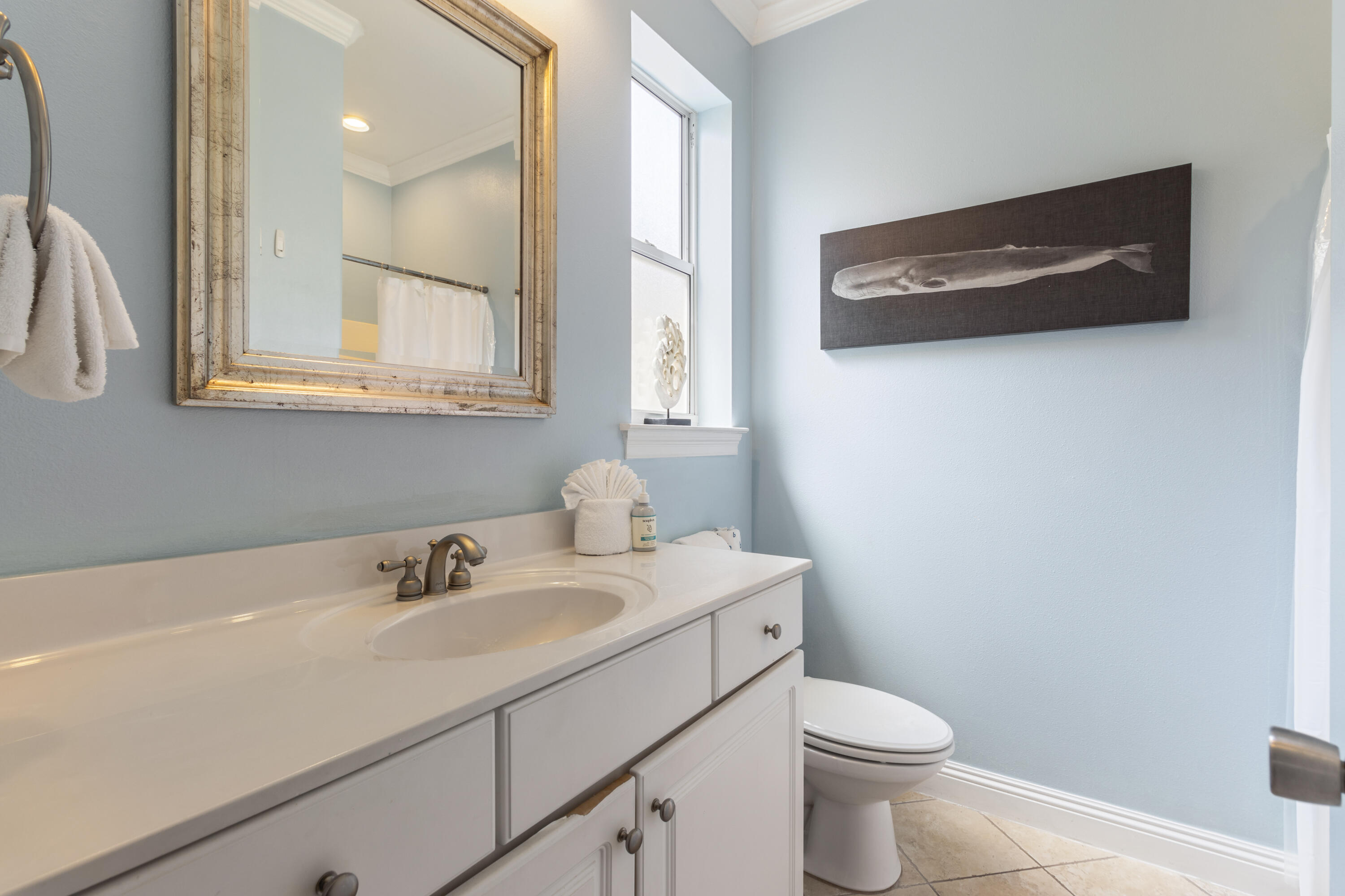 235 Kono Way Destin, FL 32541 - Photo 30 of 42 a bathroom with a sink toilet and mirror