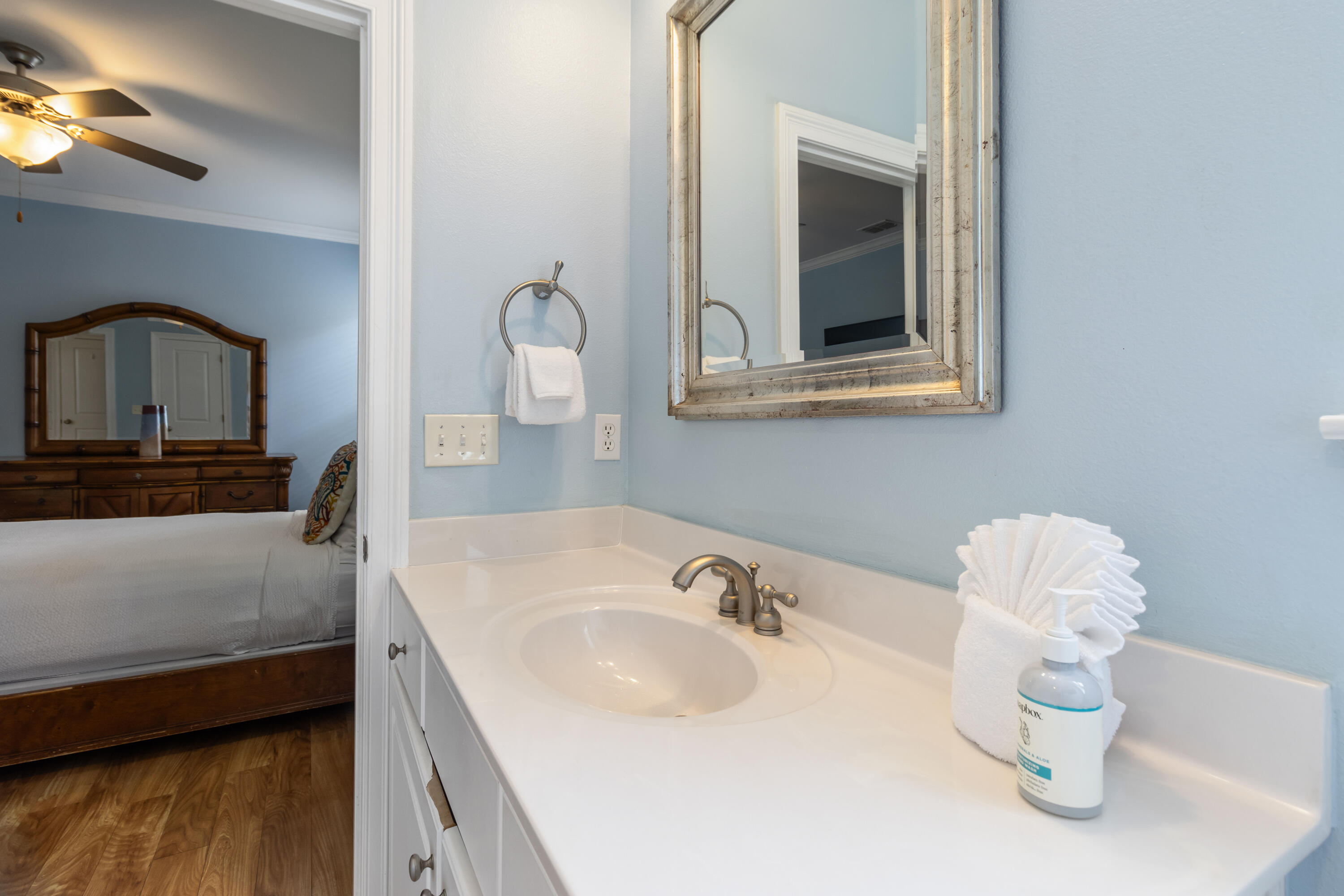 235 Kono Way Destin, FL 32541 - Photo 31 of 42 a bathroom with a sink and a mirror