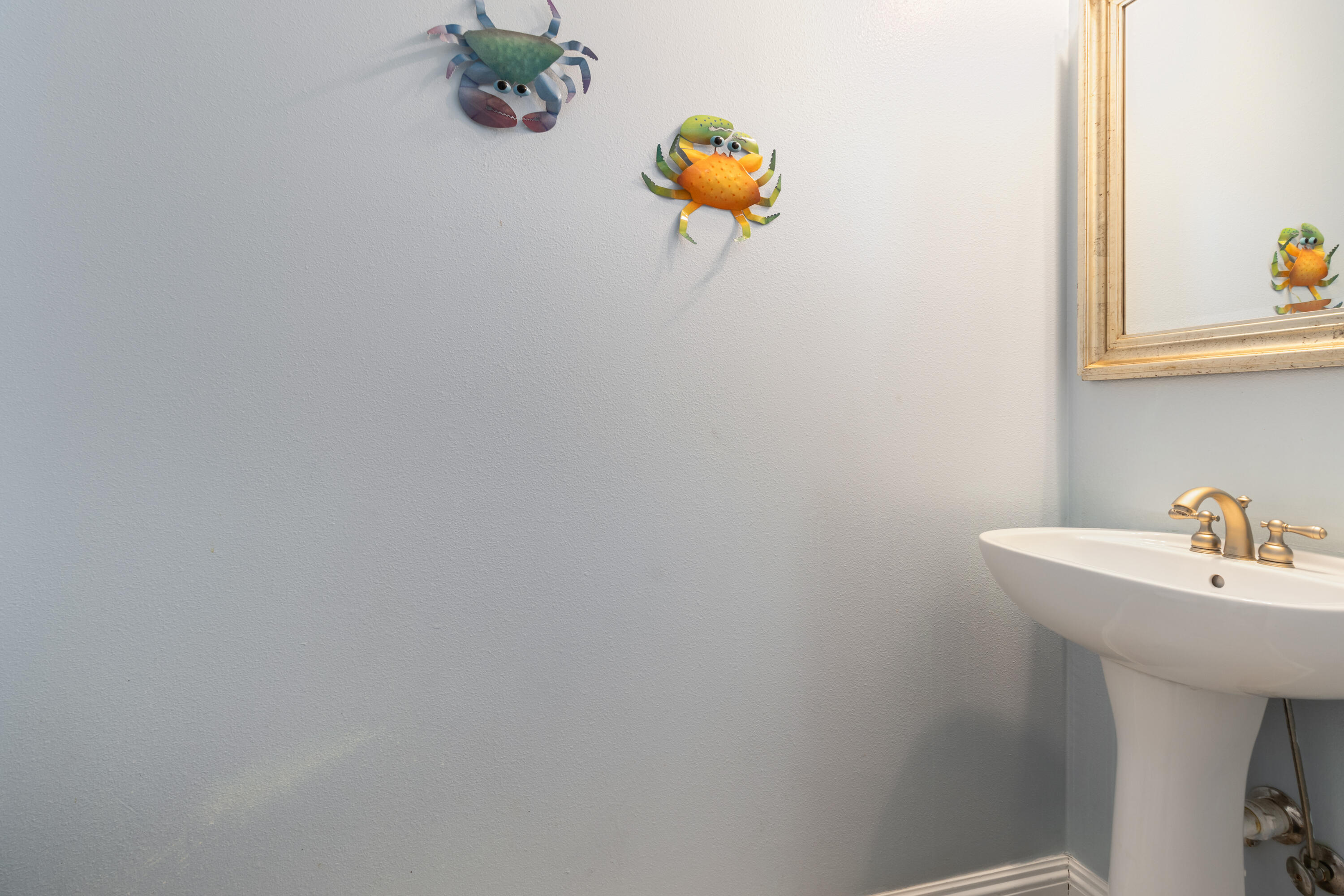 235 Kono Way Destin, FL 32541 - Photo 36 of 42 a bathroom with a sink and a mirror