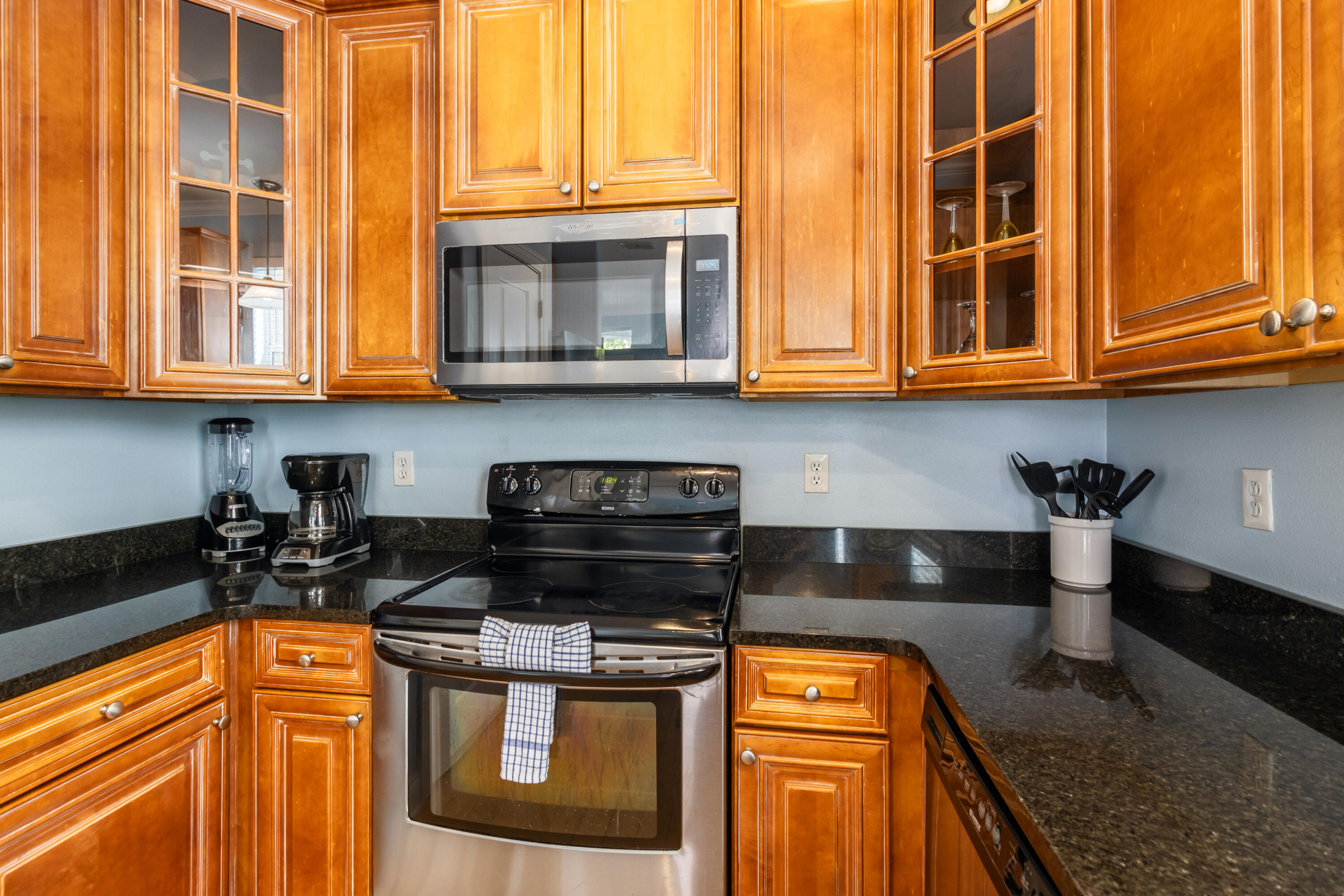 235 Kono Way Destin, FL 32541 - Photo 5 of 42 a kitchen with stainless steel appliances granite countertop a stove a sink and a microwave