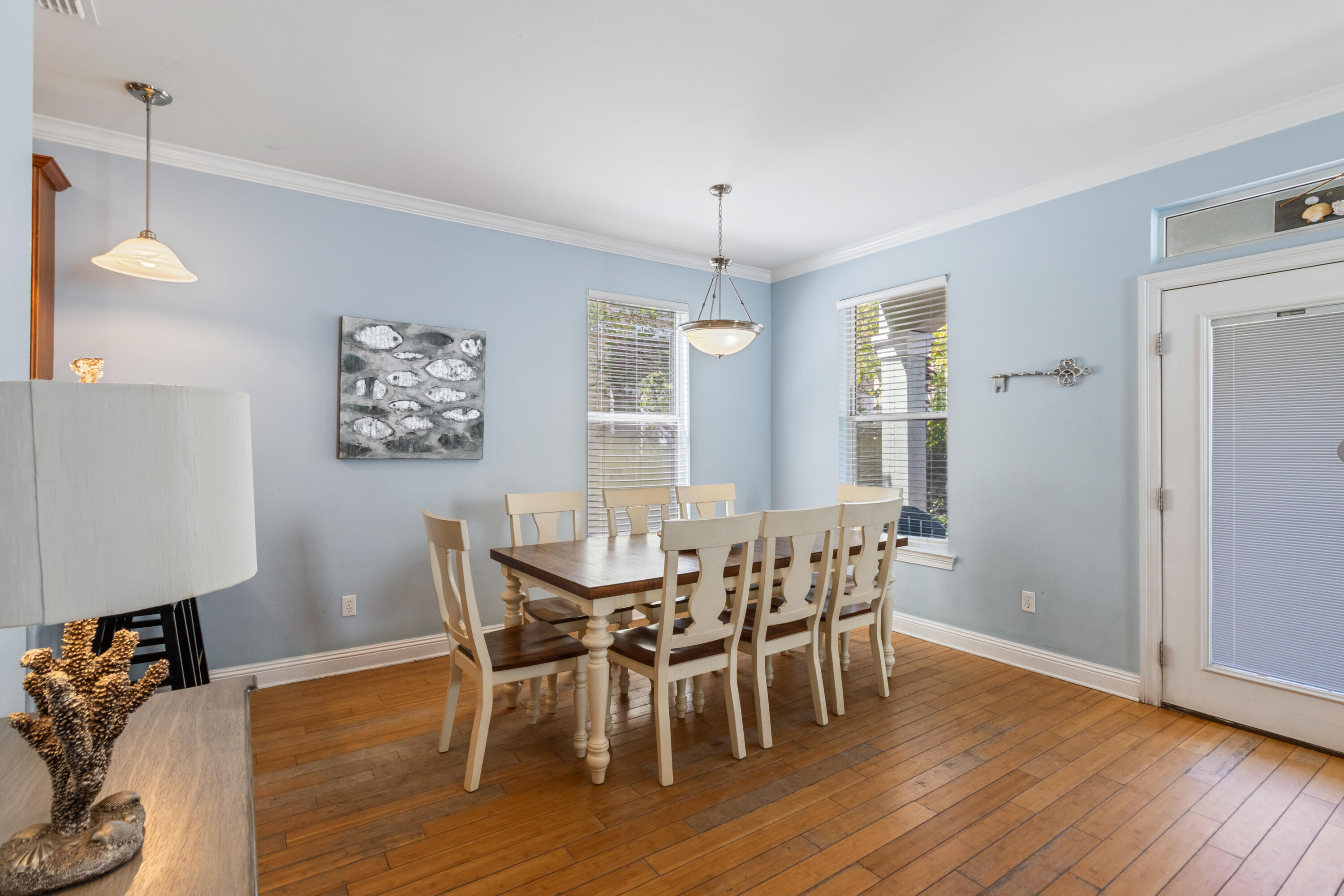 235 Kono Way Destin, FL 32541 - Photo 7 of 42 a view of a dining room with furniture window and wooden floor
