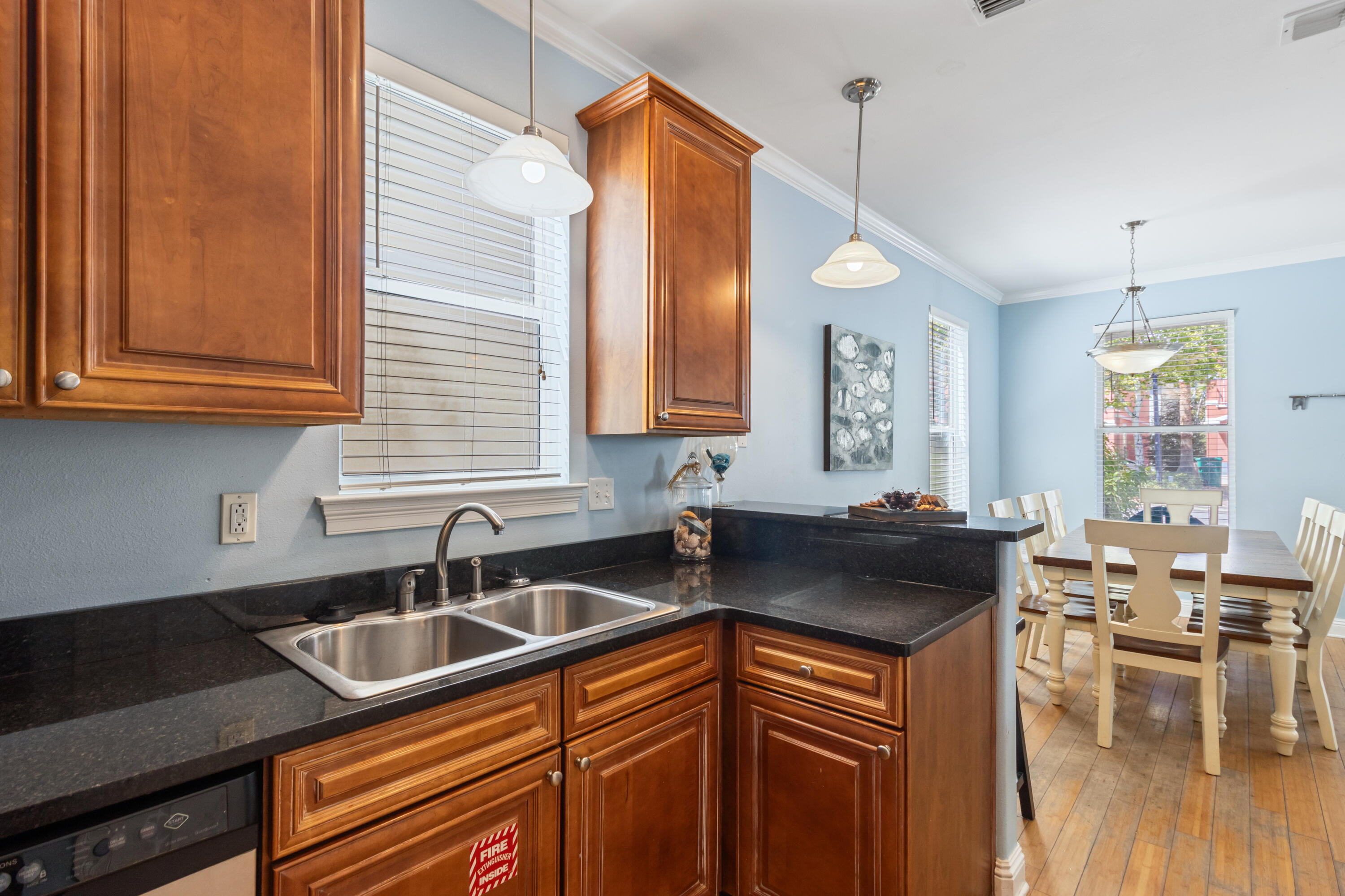 235 Kono Way Destin, FL 32541 - Photo 9 of 42 a kitchen with granite countertop a sink a stove and cabinets