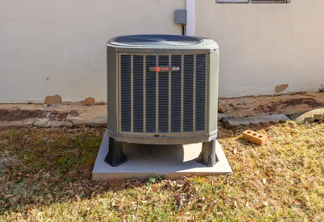 a view of a porch with a table and chairs