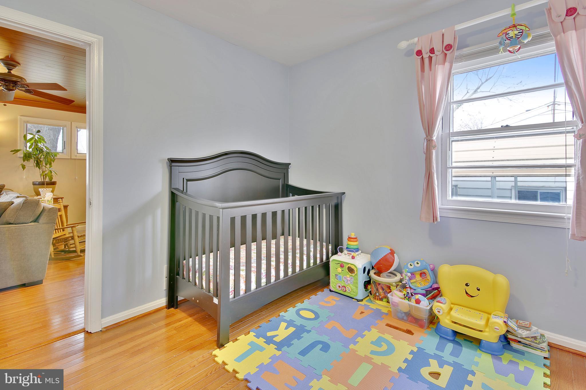 5114 Hollywood Road College Park, MD 20740 - Photo 11 of 22 a bedroom with a bed and a window