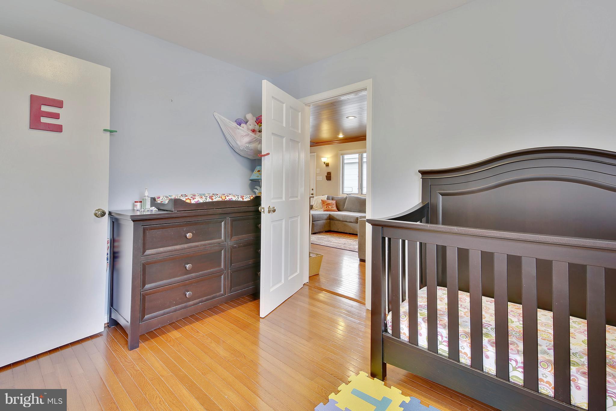 5114 Hollywood Road College Park, MD 20740 - Photo 12 of 22 a bedroom with a bed and a dresser