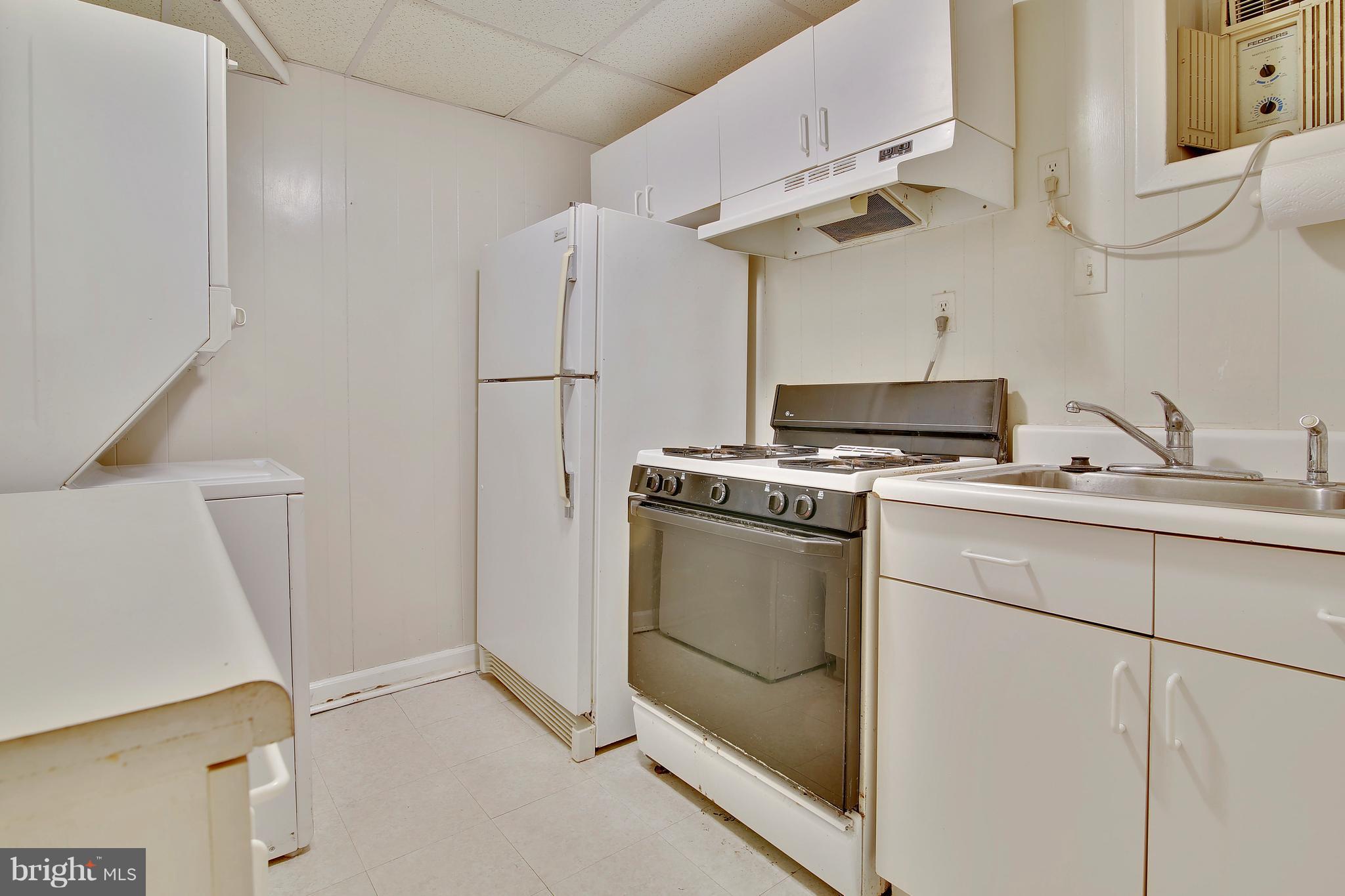 5114 Hollywood Road College Park, MD 20740 - Photo 17 of 22 a kitchen with cabinets and appliances