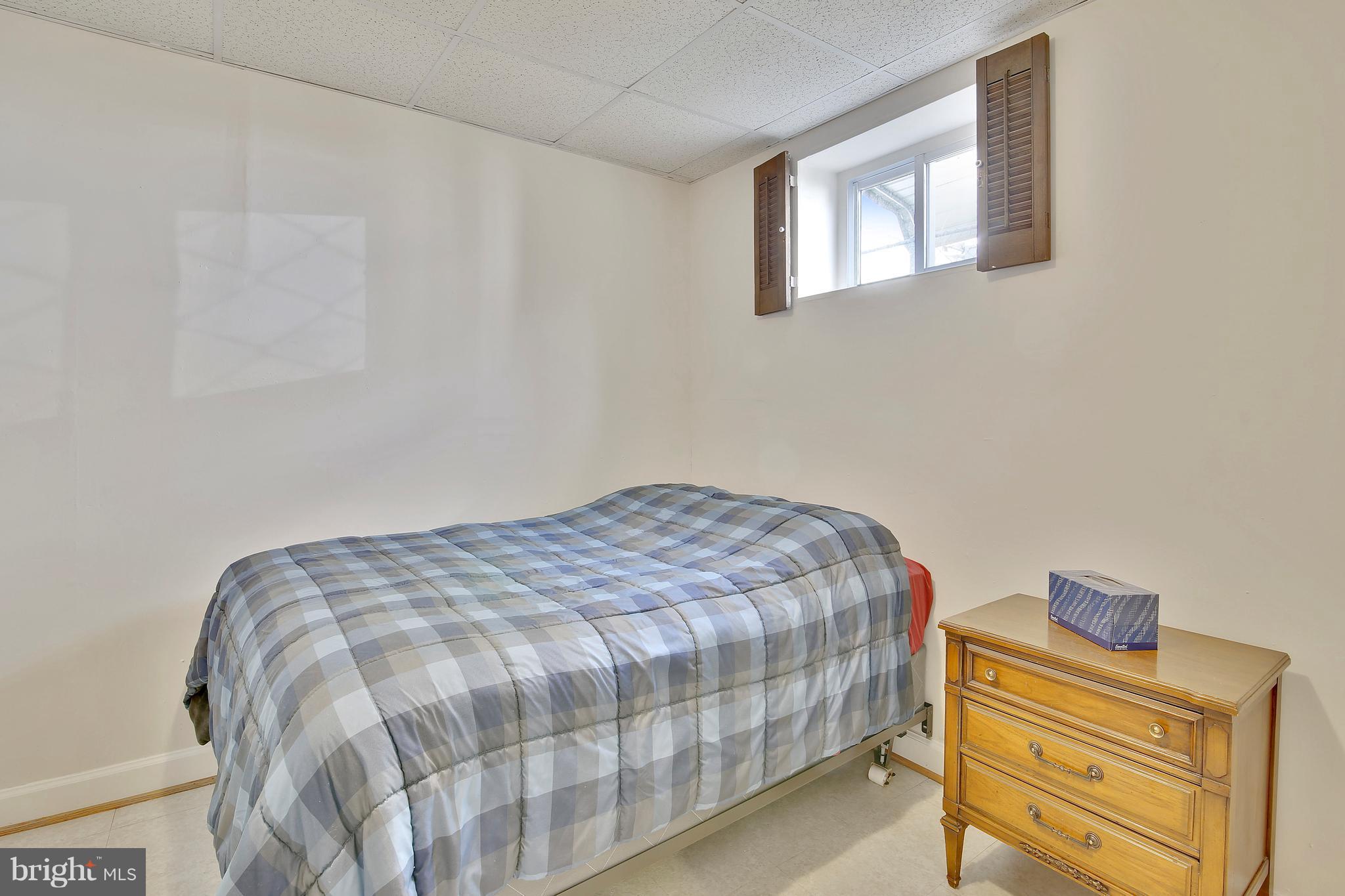 5114 Hollywood Road College Park, MD 20740 - Photo 18 of 22 a bedroom with a bed and a window