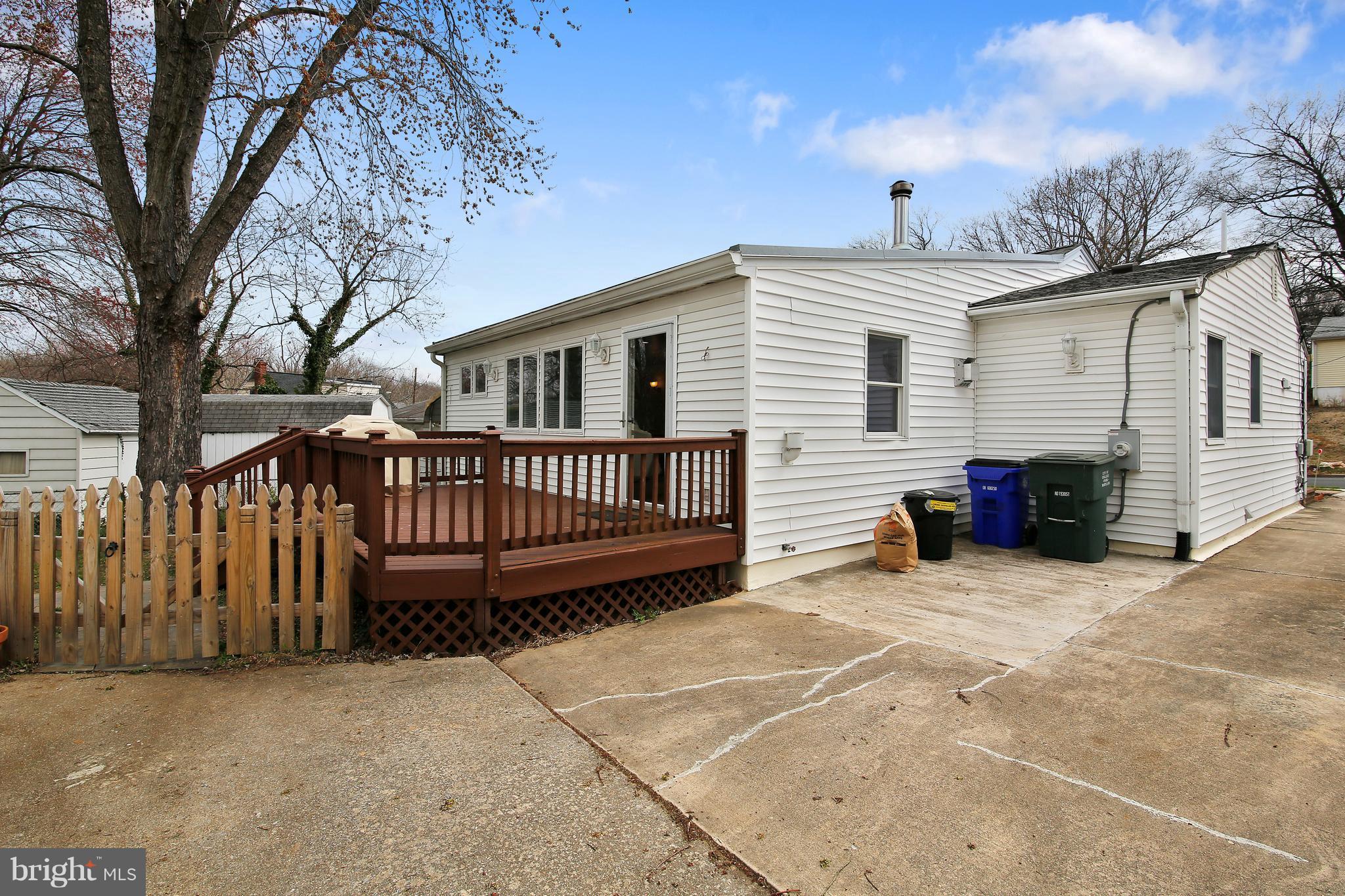 5114 Hollywood Road College Park, MD 20740 - Photo 20 of 22 a view of a house with a wooden deck and a backyard