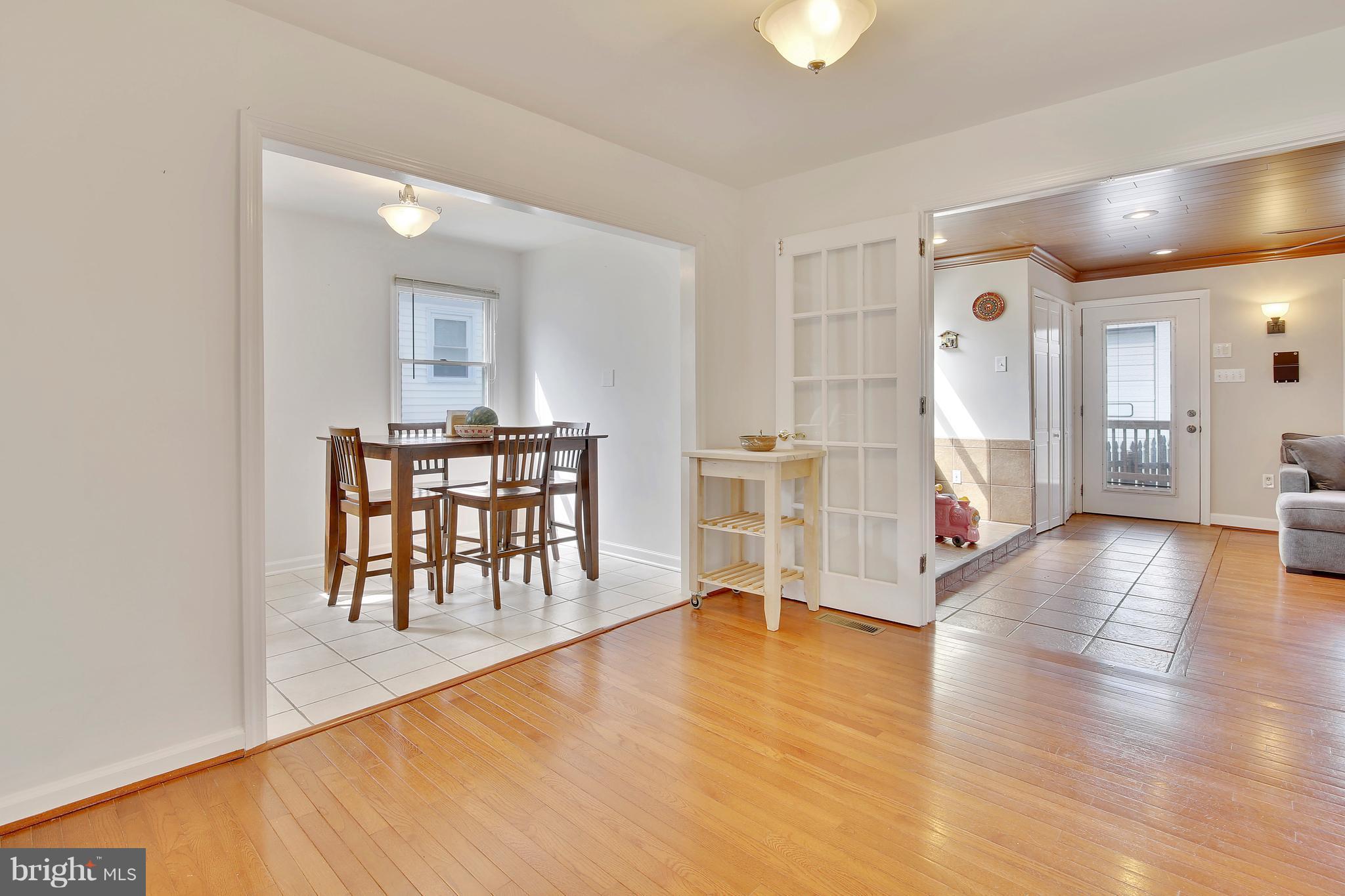 5114 Hollywood Road College Park, MD 20740 - Photo 3 of 22 a view of a livingroom with furniture and wooden floor