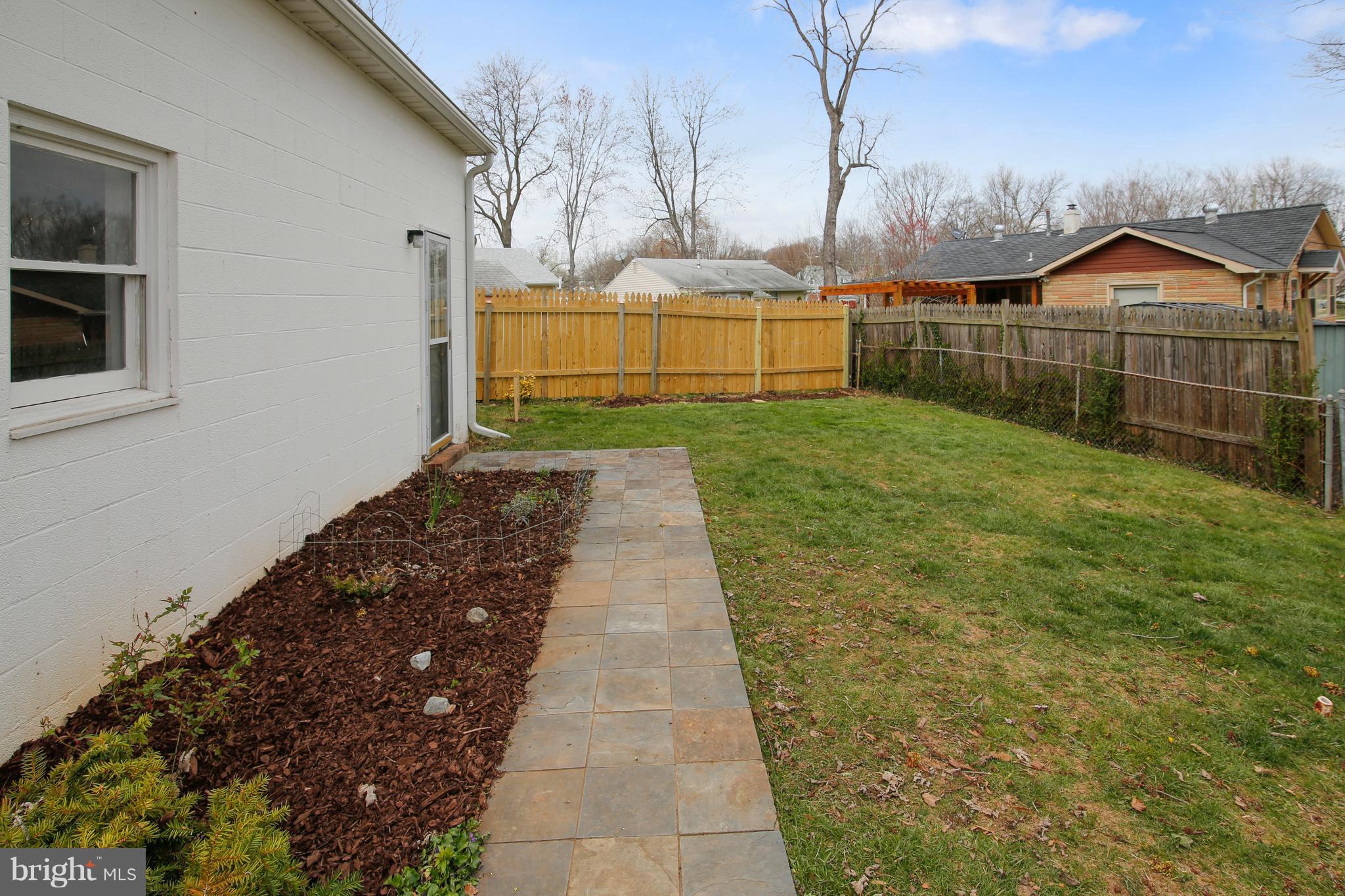 5114 Hollywood Road College Park, MD 20740 - Photo 21 of 22 a view of a backyard with brick wall