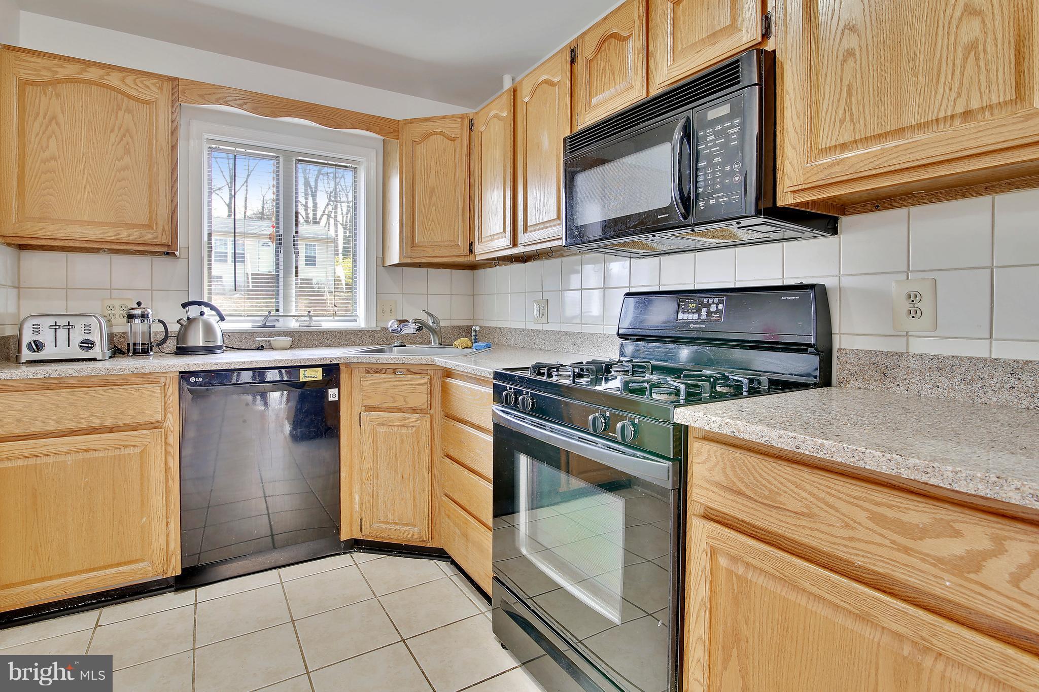 5114 Hollywood Road College Park, MD 20740 - Photo 4 of 22 a kitchen with appliances cabinets and a sink