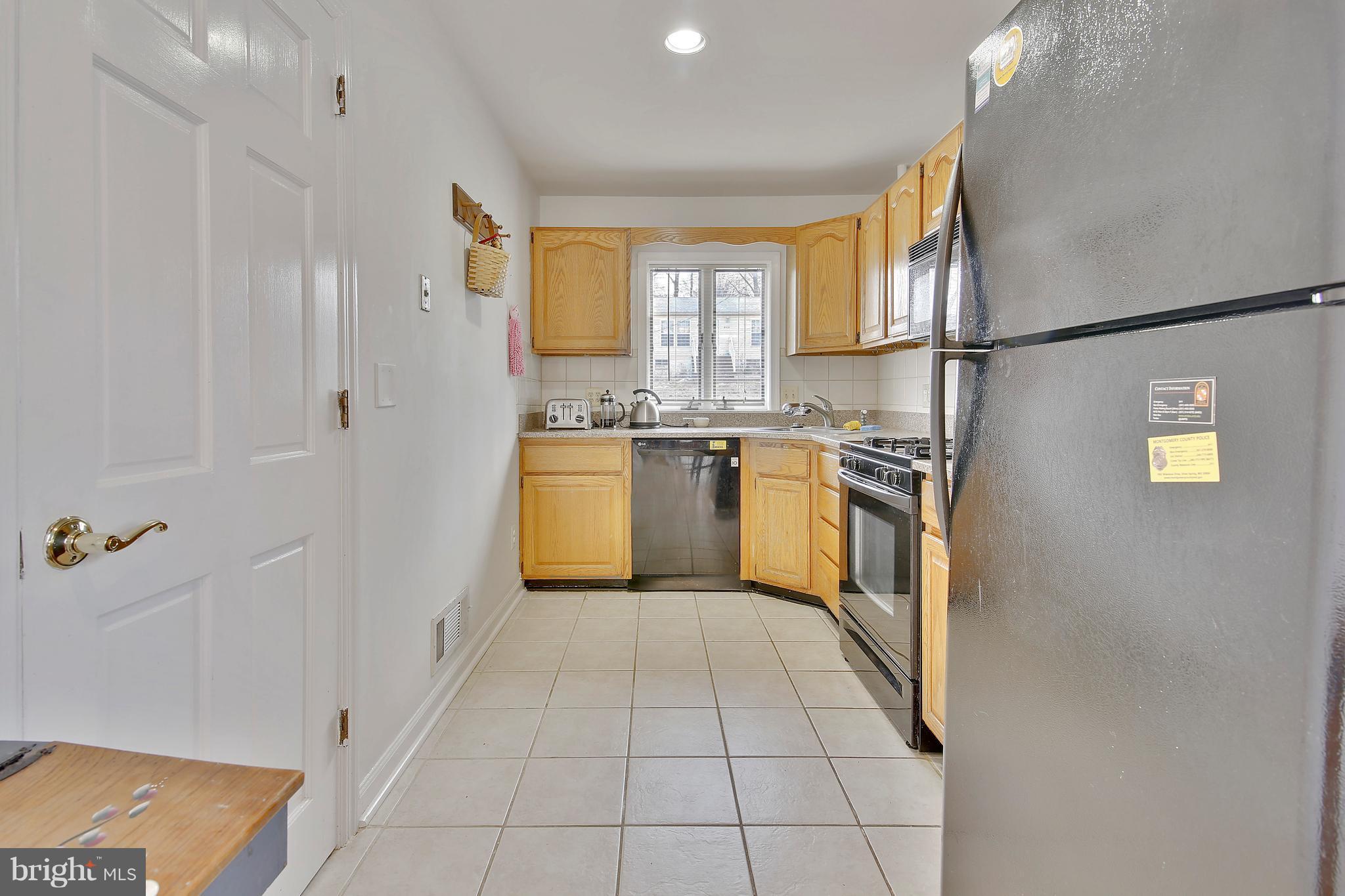 5114 Hollywood Road College Park, MD 20740 - Photo 5 of 22 a kitchen with stainless steel appliances granite countertop a refrigerator and a stove top oven