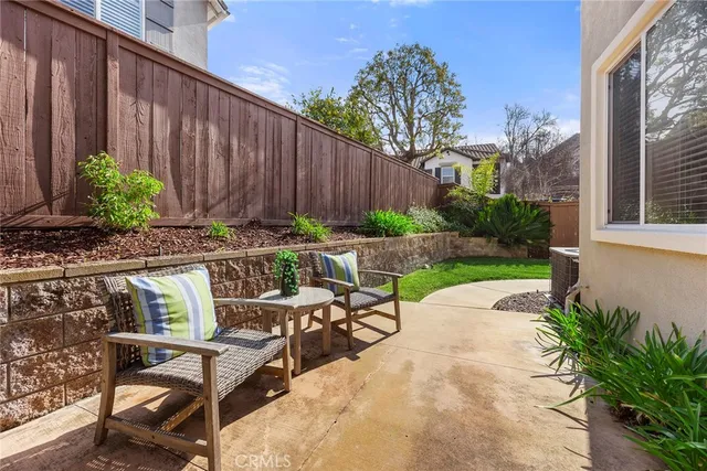 a view of table and chairs in patio