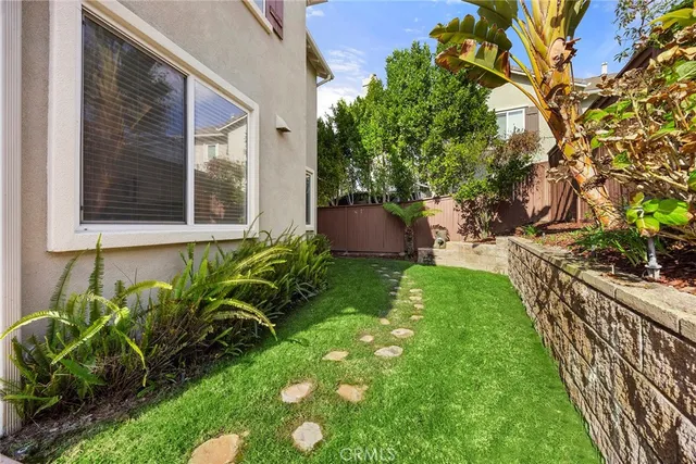 a view of a backyard with potted plants