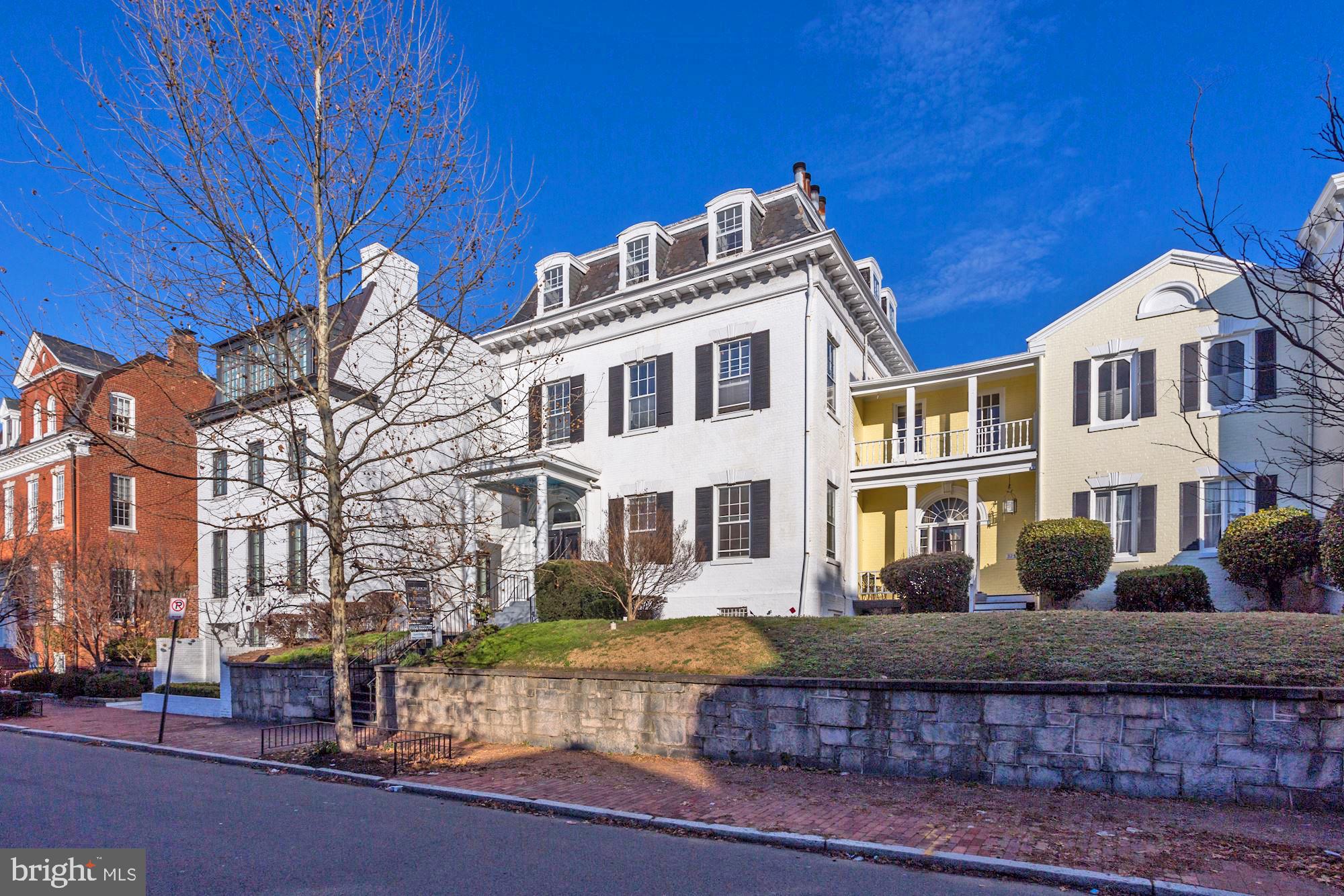 3237 N Street Northwest, Unit 16 Washington, DC 20007 - Photo 12 of 16 a front view of a residential apartment building with a yard