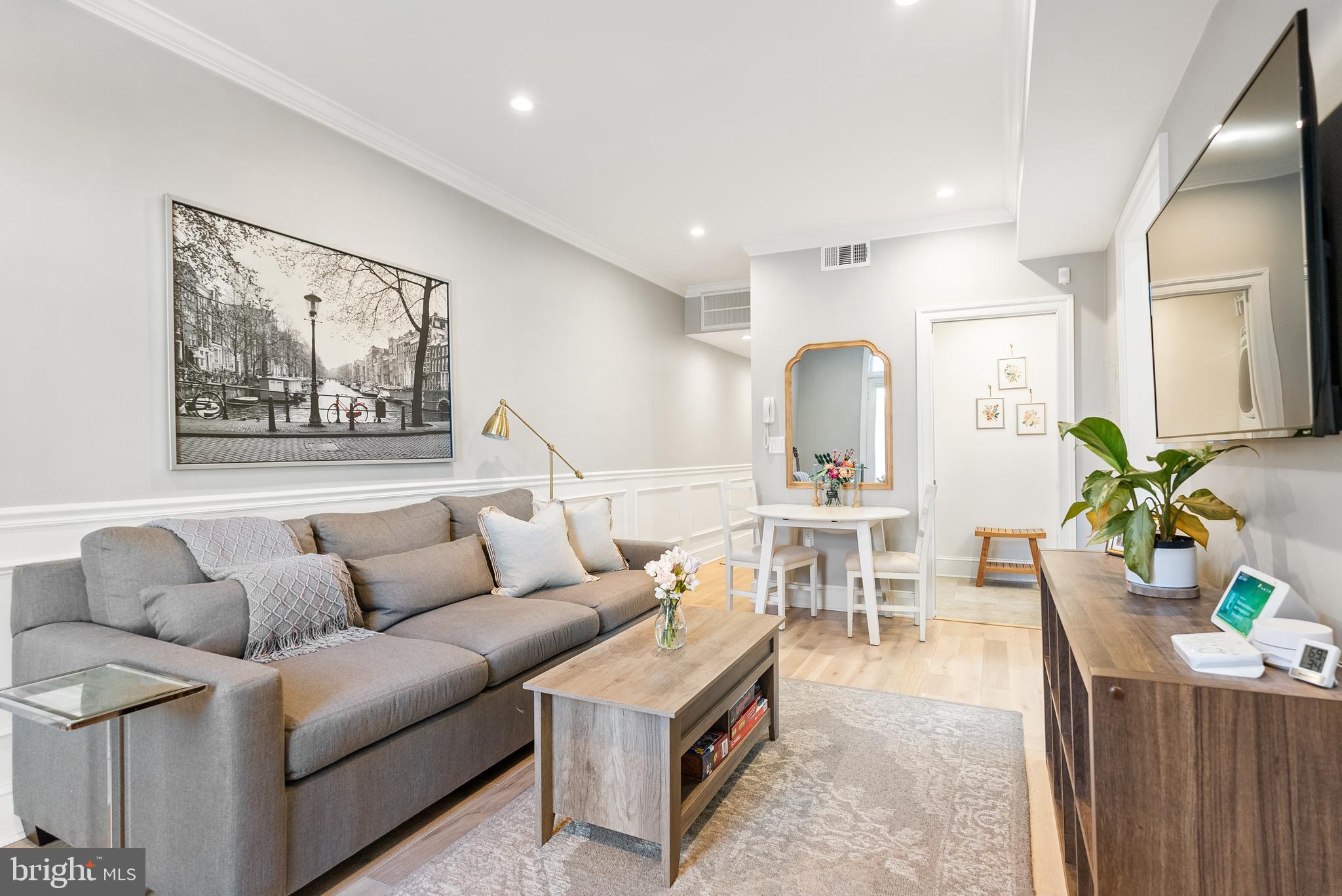 3237 N Street Northwest, Unit 16 Washington, DC 20007 - Photo 4 of 16 a living room with furniture and wooden floor