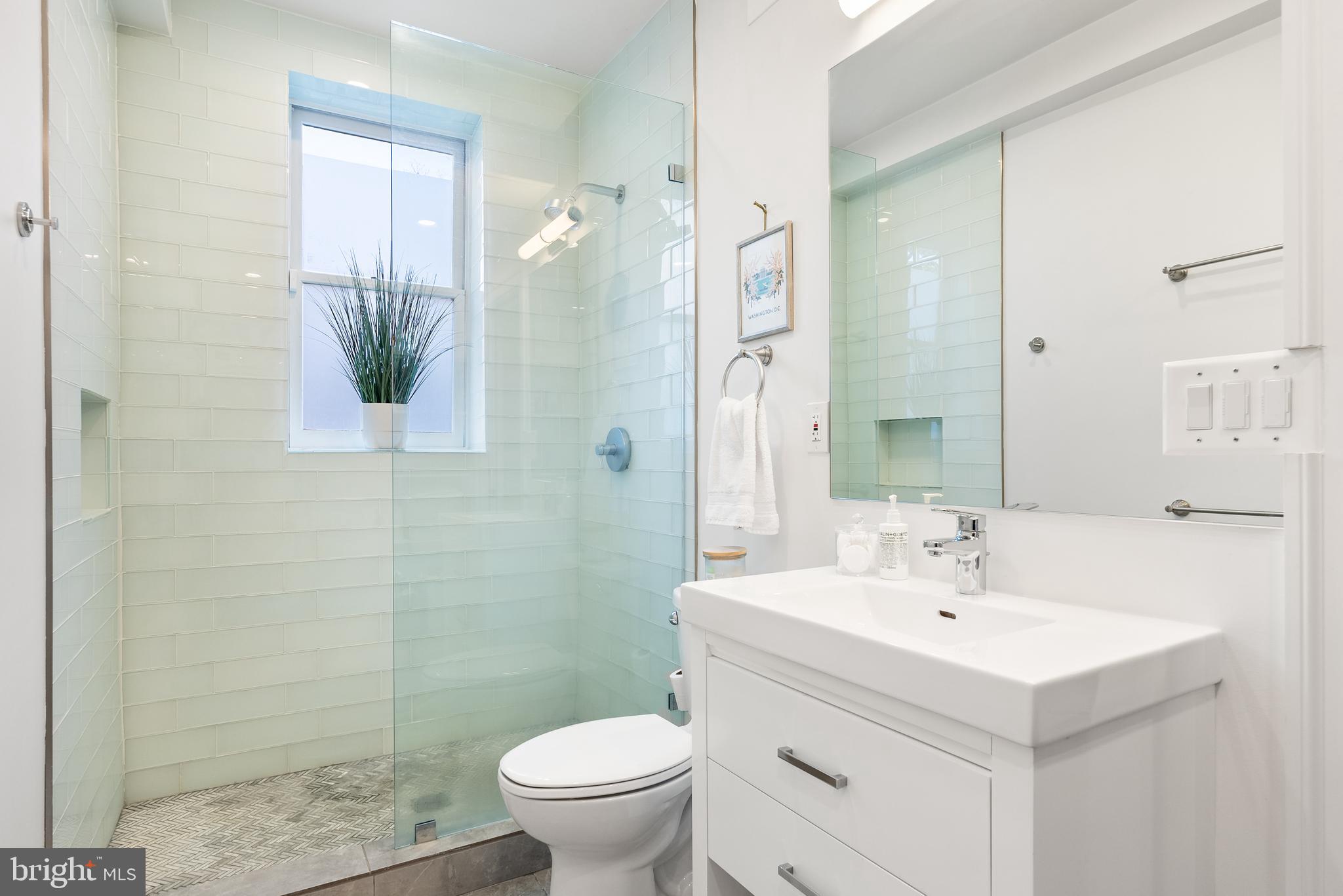 3237 N Street Northwest, Unit 16 Washington, DC 20007 - Photo 8 of 16 a bathroom with a sink toilet and shower