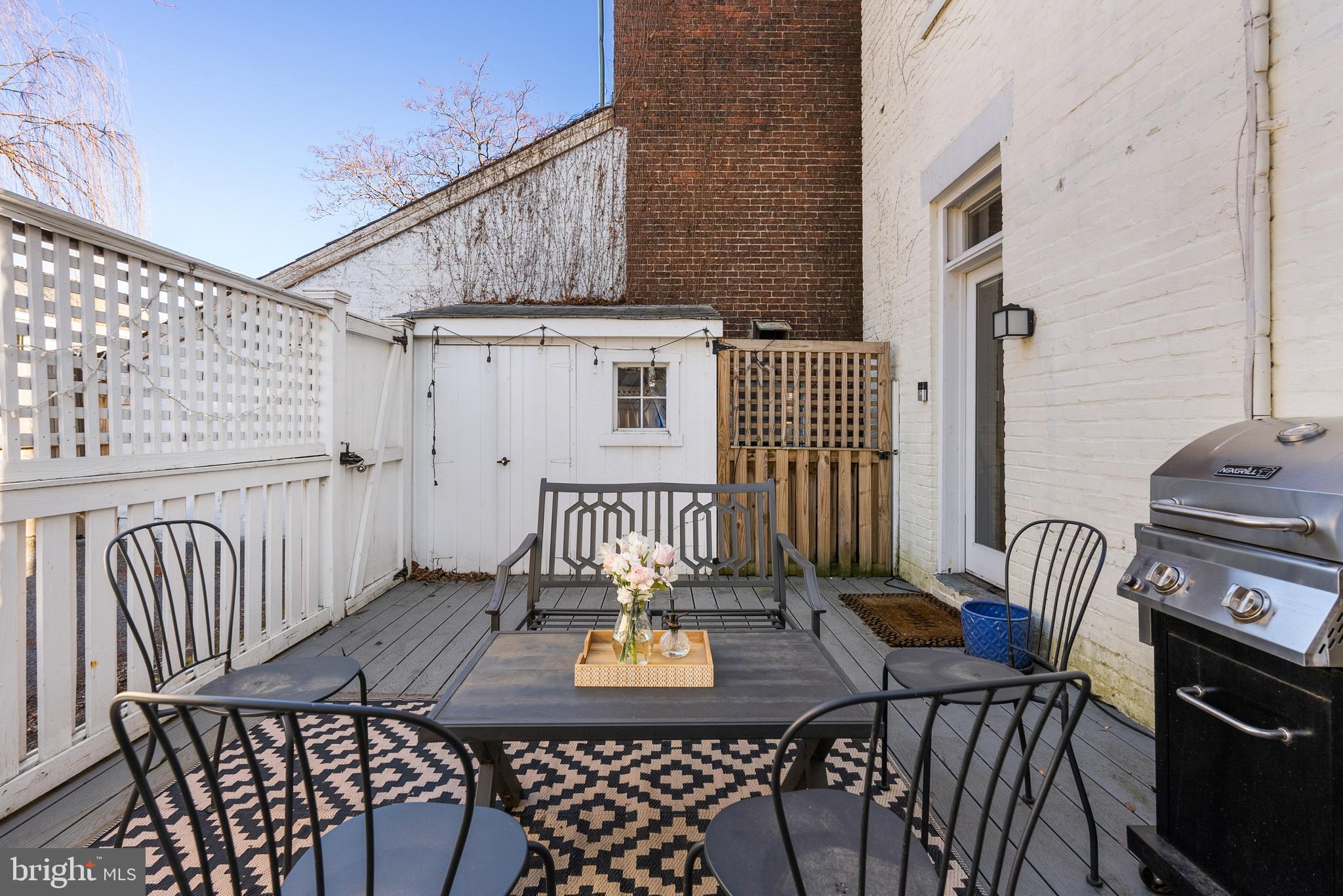 3237 N Street Northwest, Unit 16 Washington, DC 20007 - Photo 10 of 16 a view of a patio with a table and chairs