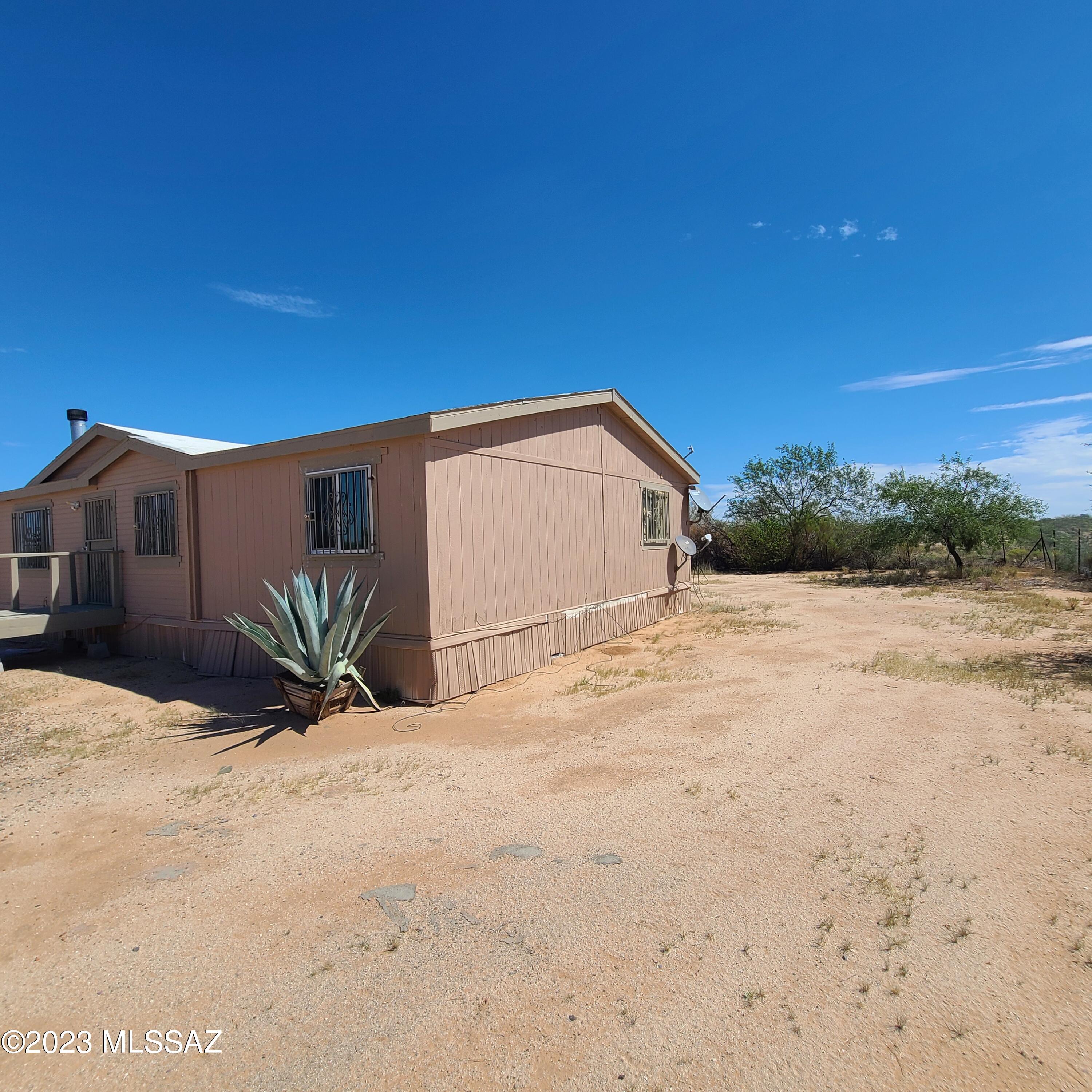 8896 South Marstellar Road Tucson, AZ 85736 - Photo 39 of 39 a view of a house with a yard
