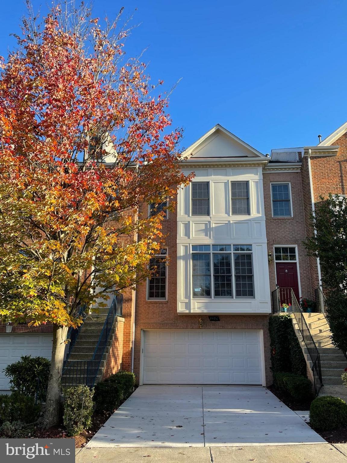 8406 Bells Ridge Terrace Potomac, MD 20854 - Photo 2 of 13 a front view of a house with a yard