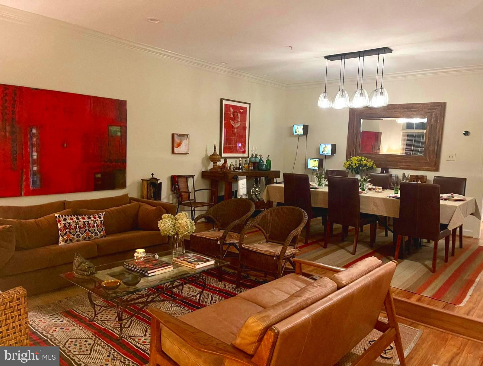 8406 Bells Ridge Terrace Potomac, MD 20854 - Photo 3 of 13 a living room with furniture and a chandelier