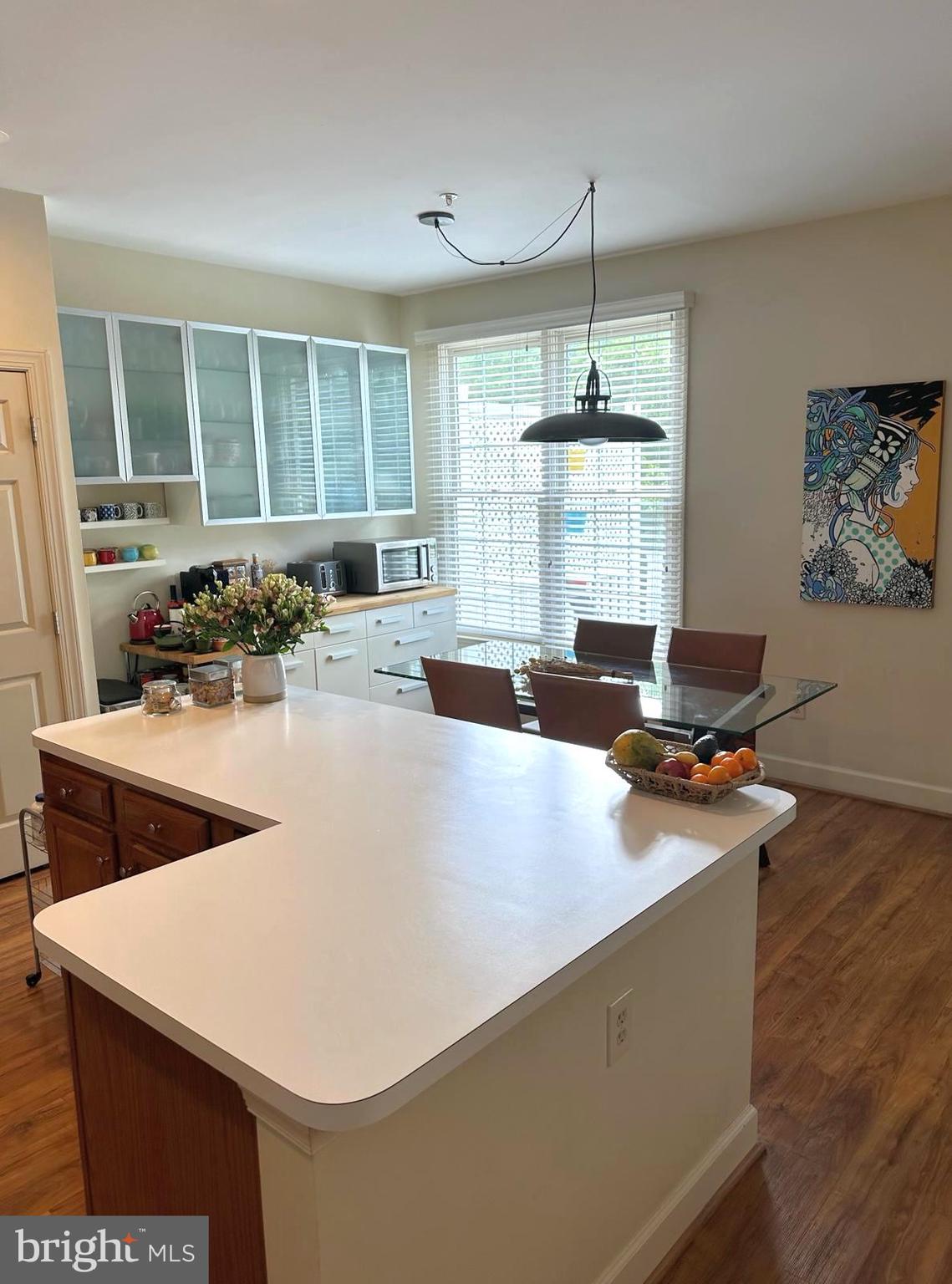 8406 Bells Ridge Terrace Potomac, MD 20854 - Photo 5 of 13 a open kitchen with stainless steel appliances granite countertop a sink a stove and a refrigerator