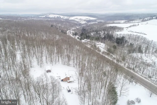 a kitchen with stainless steel appliances granite countertop wooden cabinets sink stove and microwave