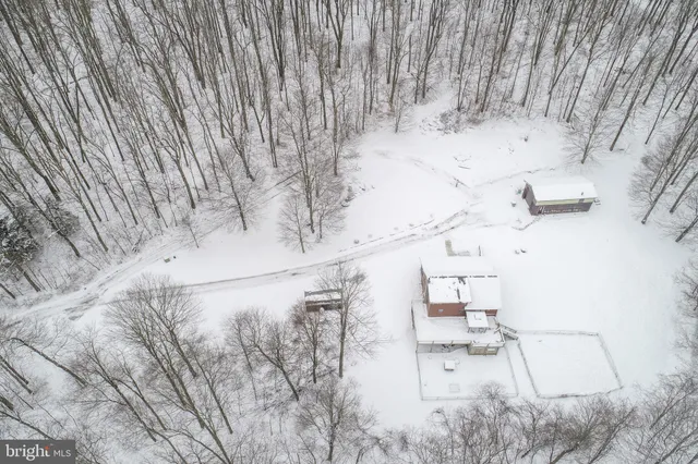 a kitchen with stainless steel appliances granite countertop wooden cabinets sink and a granite counter top
