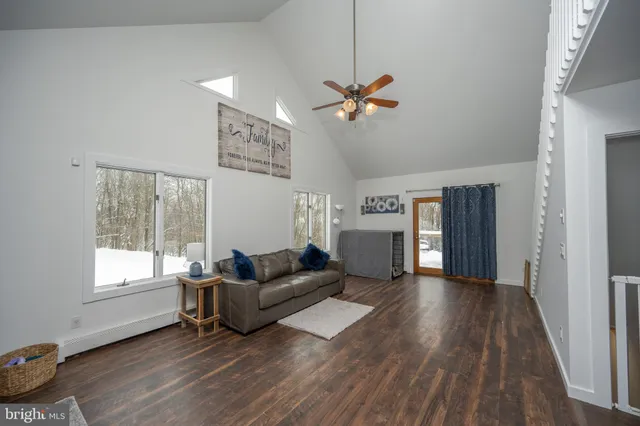 a bedroom with furniture and a wooden floor