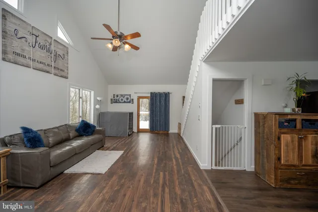 a bed room with a bed and a chandelier