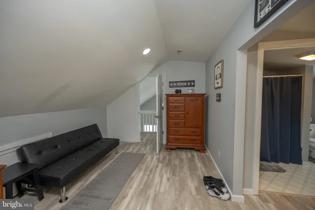 a room with lots of wooden furniture and wooden floor