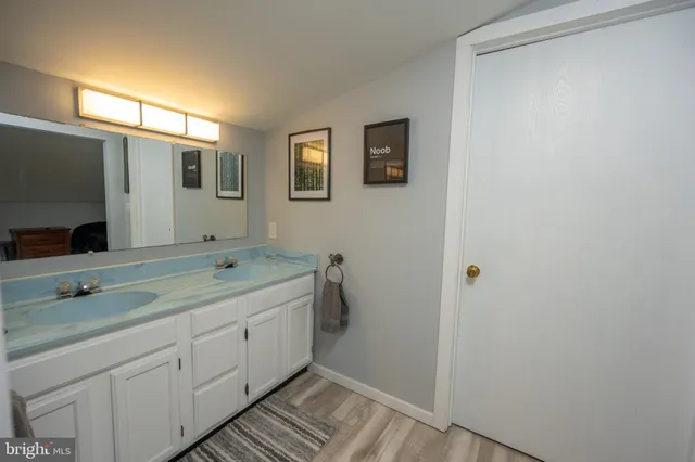 a bathroom with a shower and a window