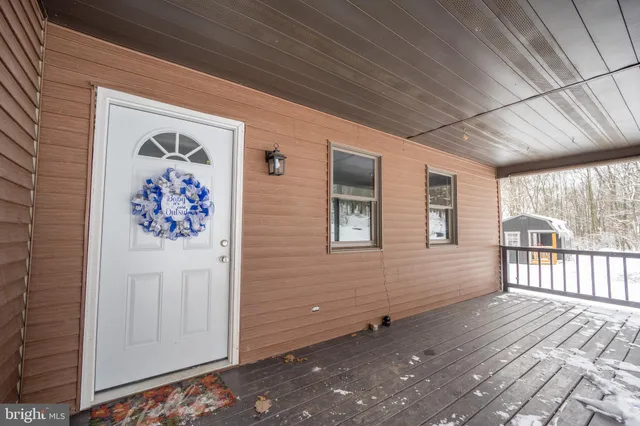 a view of hallway with wooden floor