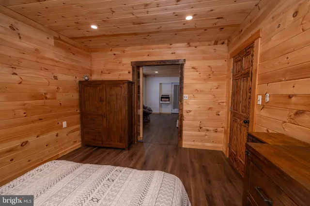 a front view of a house with a yard covered in snow