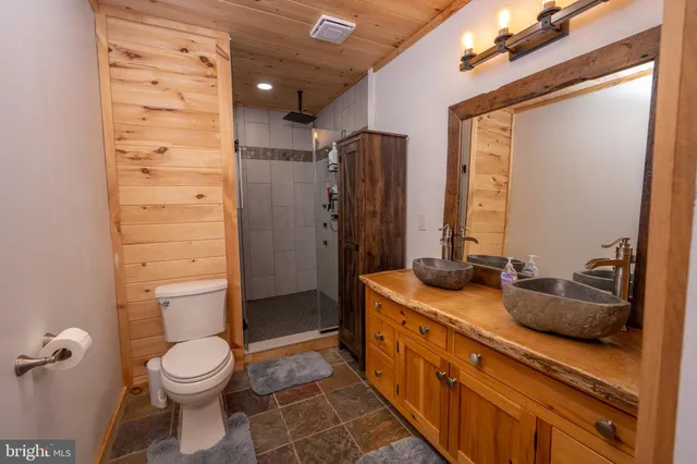 a front view of a house with a yard covered in snow