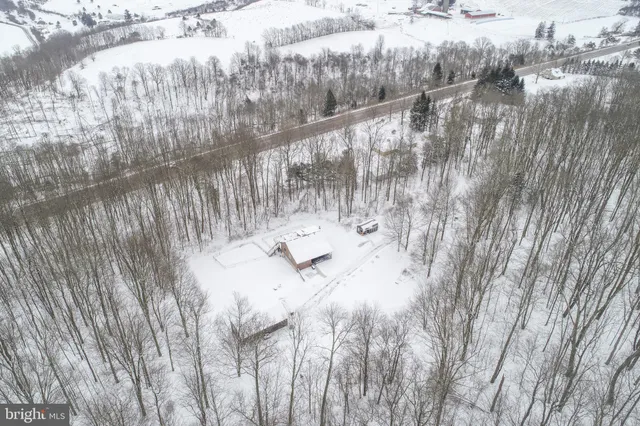 a view of a snow on the road