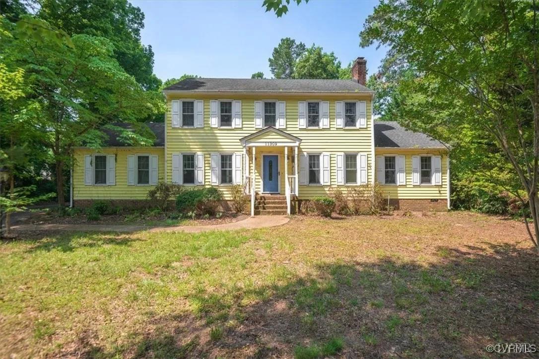 front view of a house with a yard