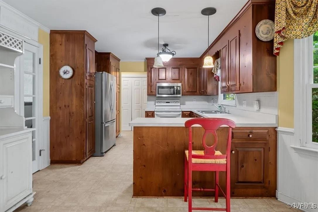 11309 Pendleton Place Chesterfield, VA 23236 - Photo 3 of 4 a kitchen with stainless steel appliances granite countertop a refrigerator and microwave