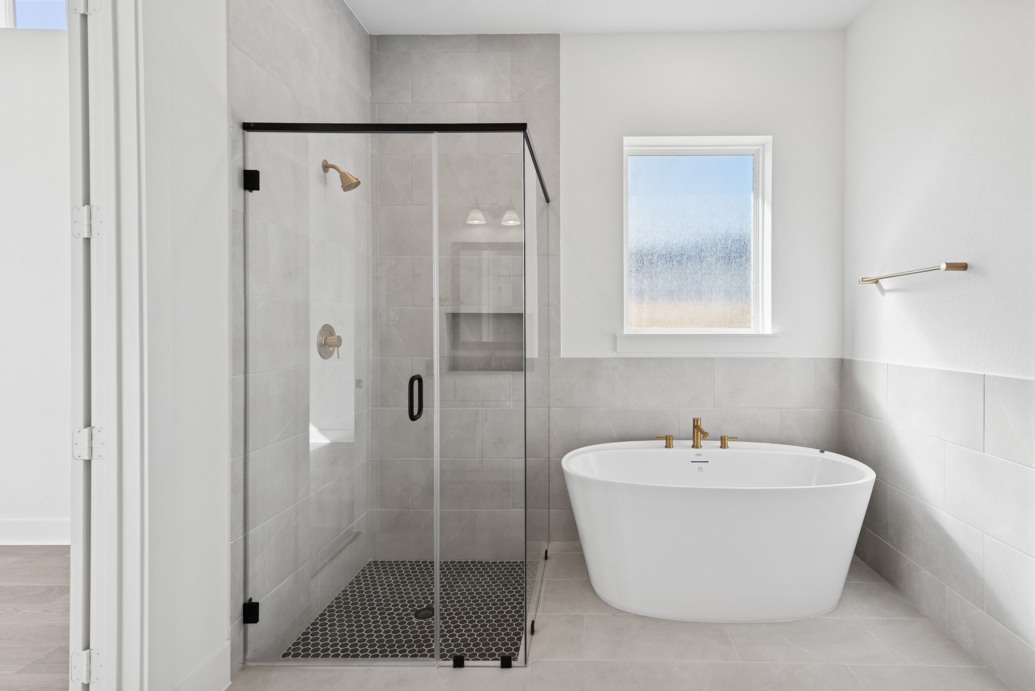 16138 Rita Road Conroe, TX 77302 - Photo 40 of 50 a white bath tub sitting next to a bathroom sink
